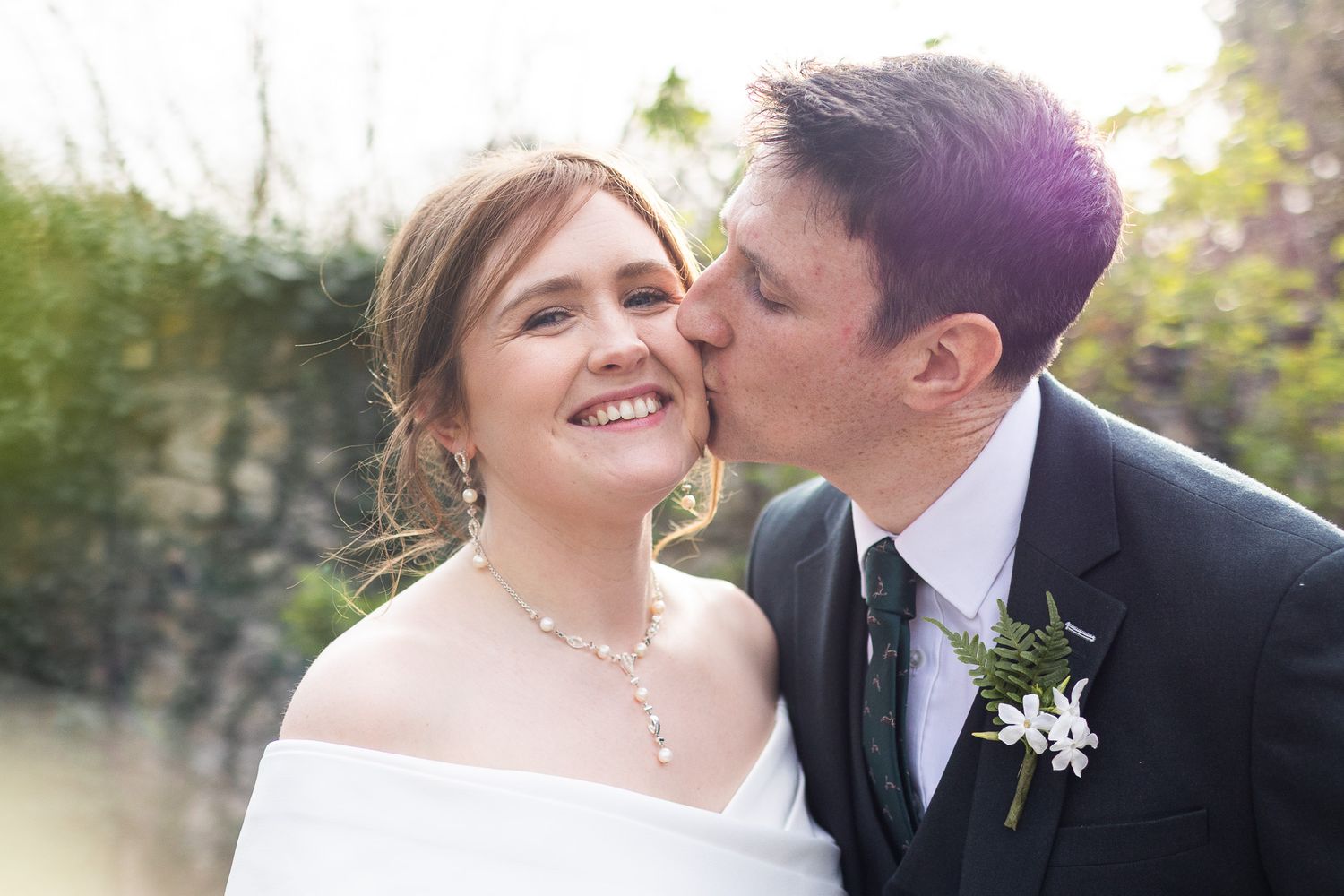 Joyful wedding portraits captured by Laura Conlon Dublin wedding photographer, outdoors showing natural moments between newlyweds.