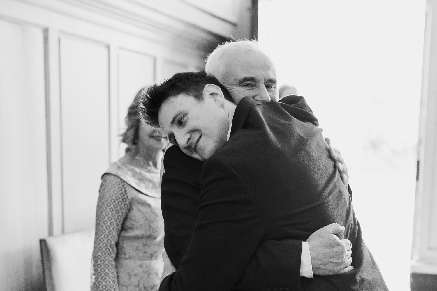 A black and white photo capturing an emotional embrace at Dublin CIty wedding in MoLI .