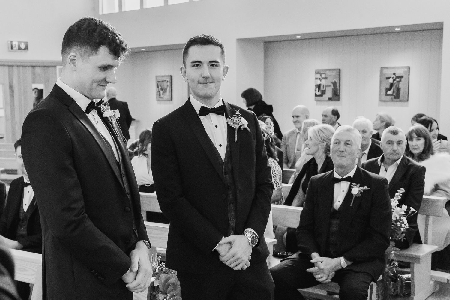 Black and white photo of Dublin wedding guests mingling at a 25 Fitzwilliam place.