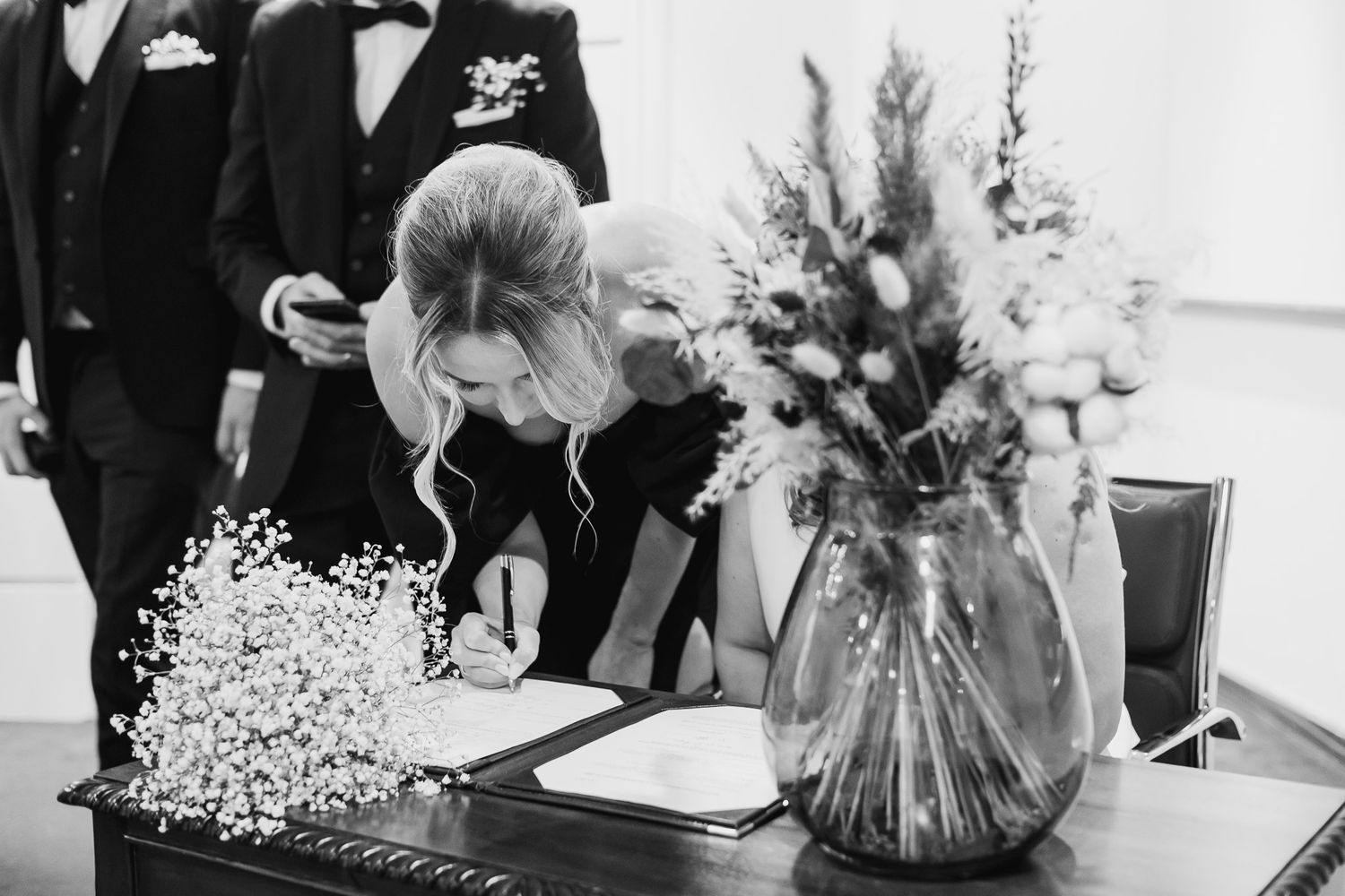 A  Dublin wedding party poses with delicate baby's breath bouquets in Dublins registry office.