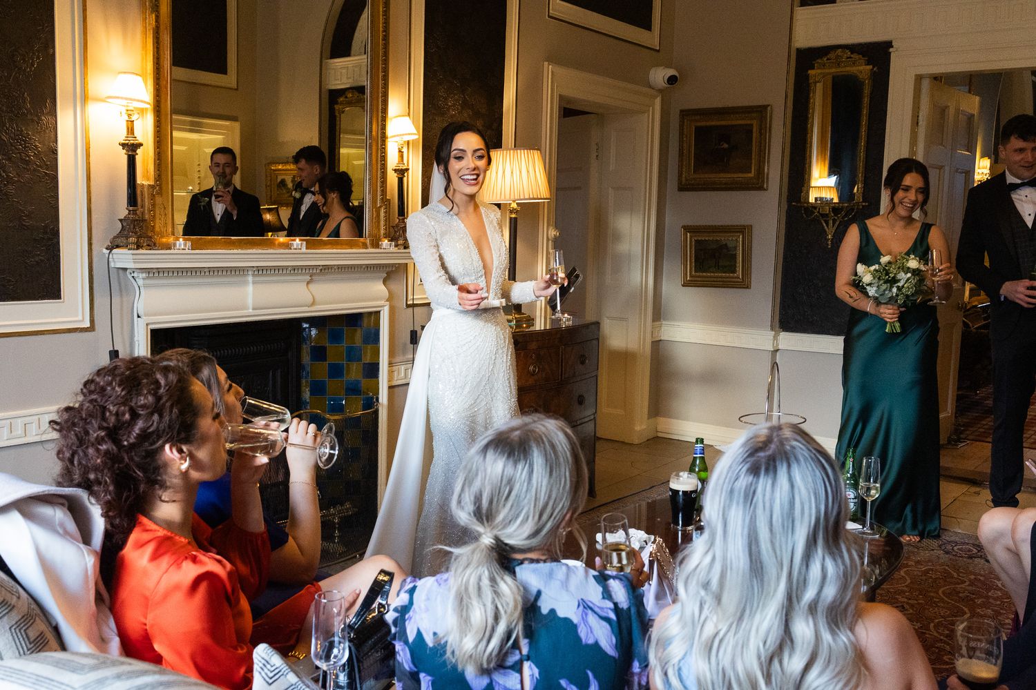 Wedding reception guests seated in an Tankardstown with warm lighting and classic decor, photo by Dublin CIty wedding photographer.