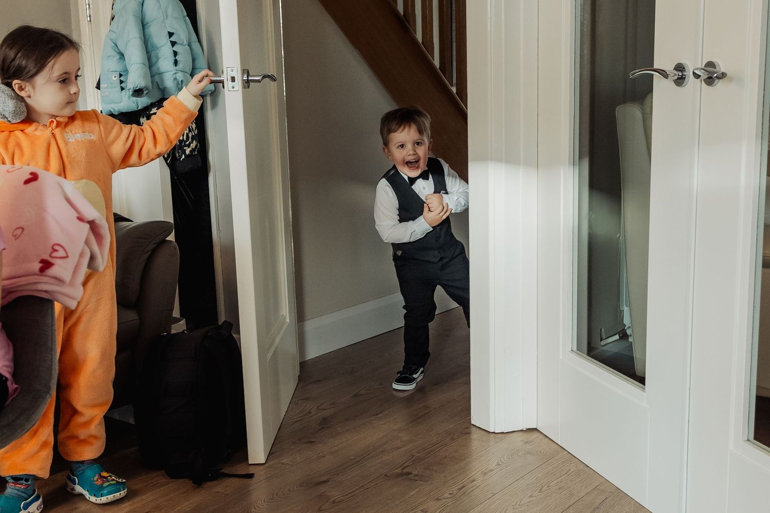 Children playing and running through hallways during wedding festivities.