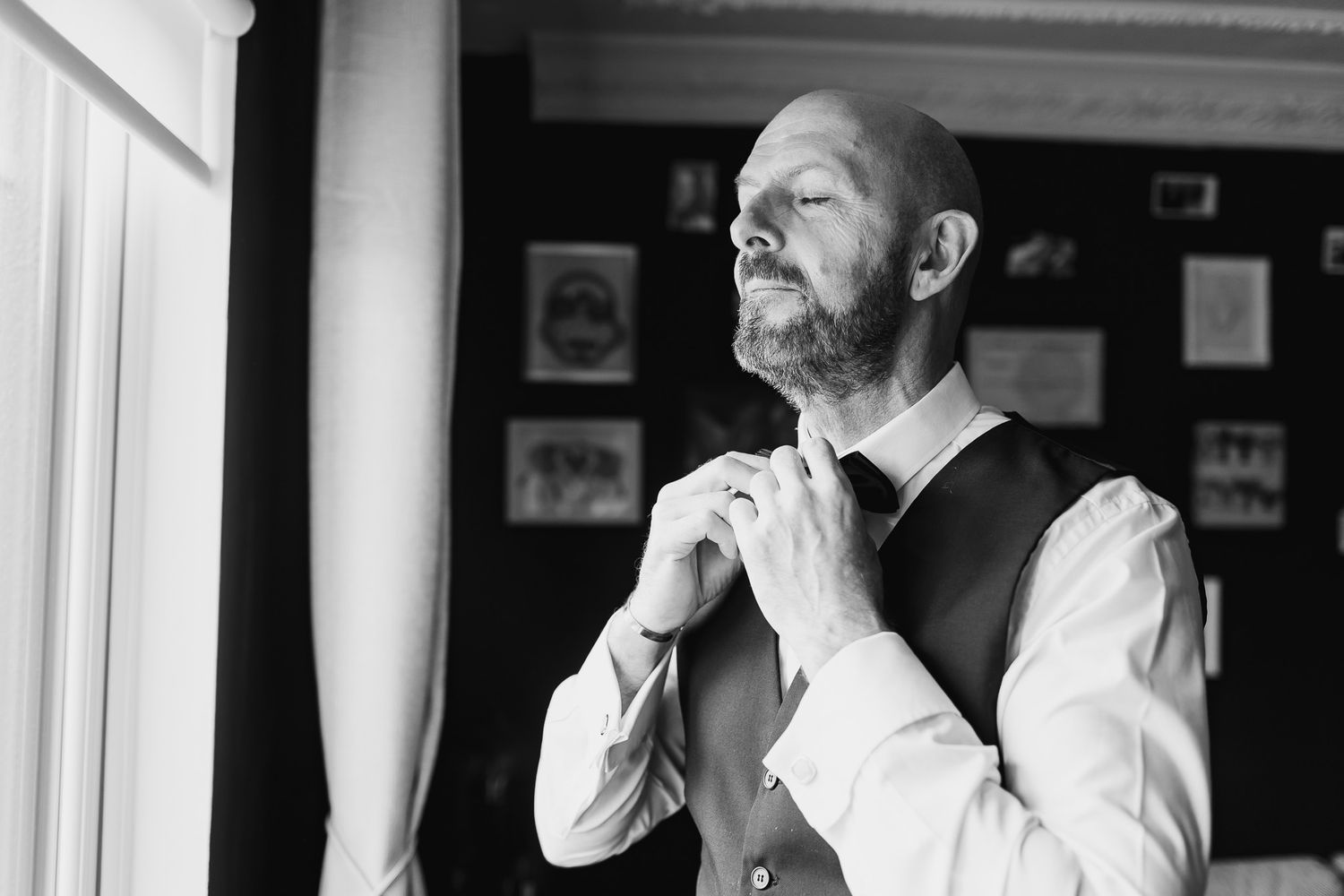 Black and white photo showing wedding preparation moments in an indoor setting of Dublin City