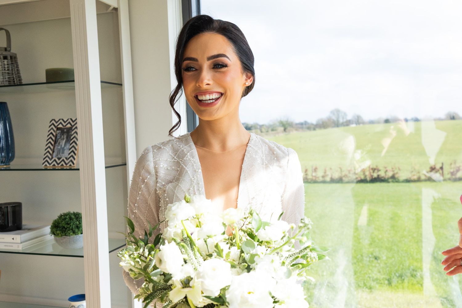 Wedding preparations with delicate floral bouquets and natural light streaming through  at 25 Fitzwilliam place
