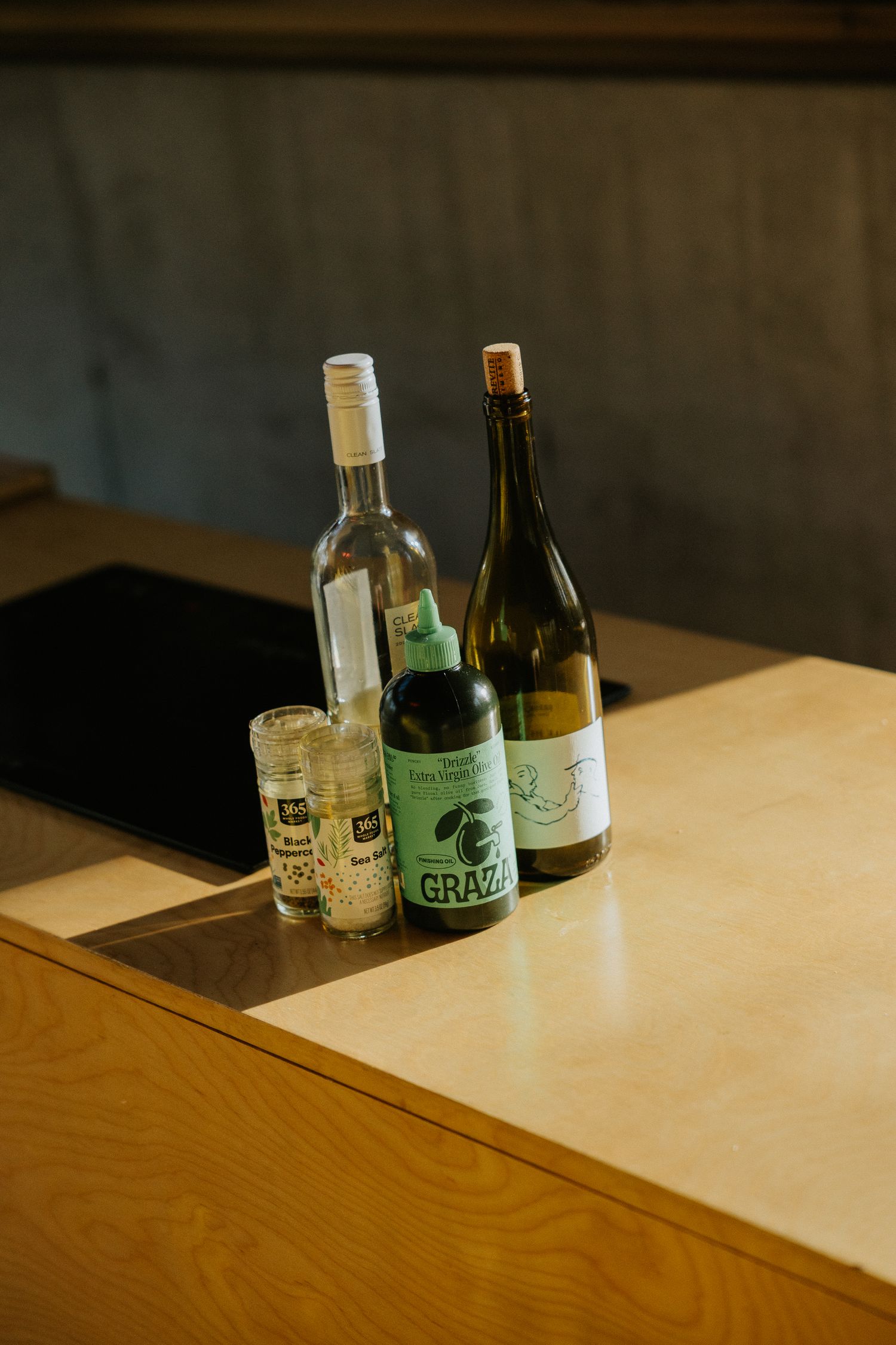 graza olive oil and wine bottle on kitchen counter top, shot by dylan spangler