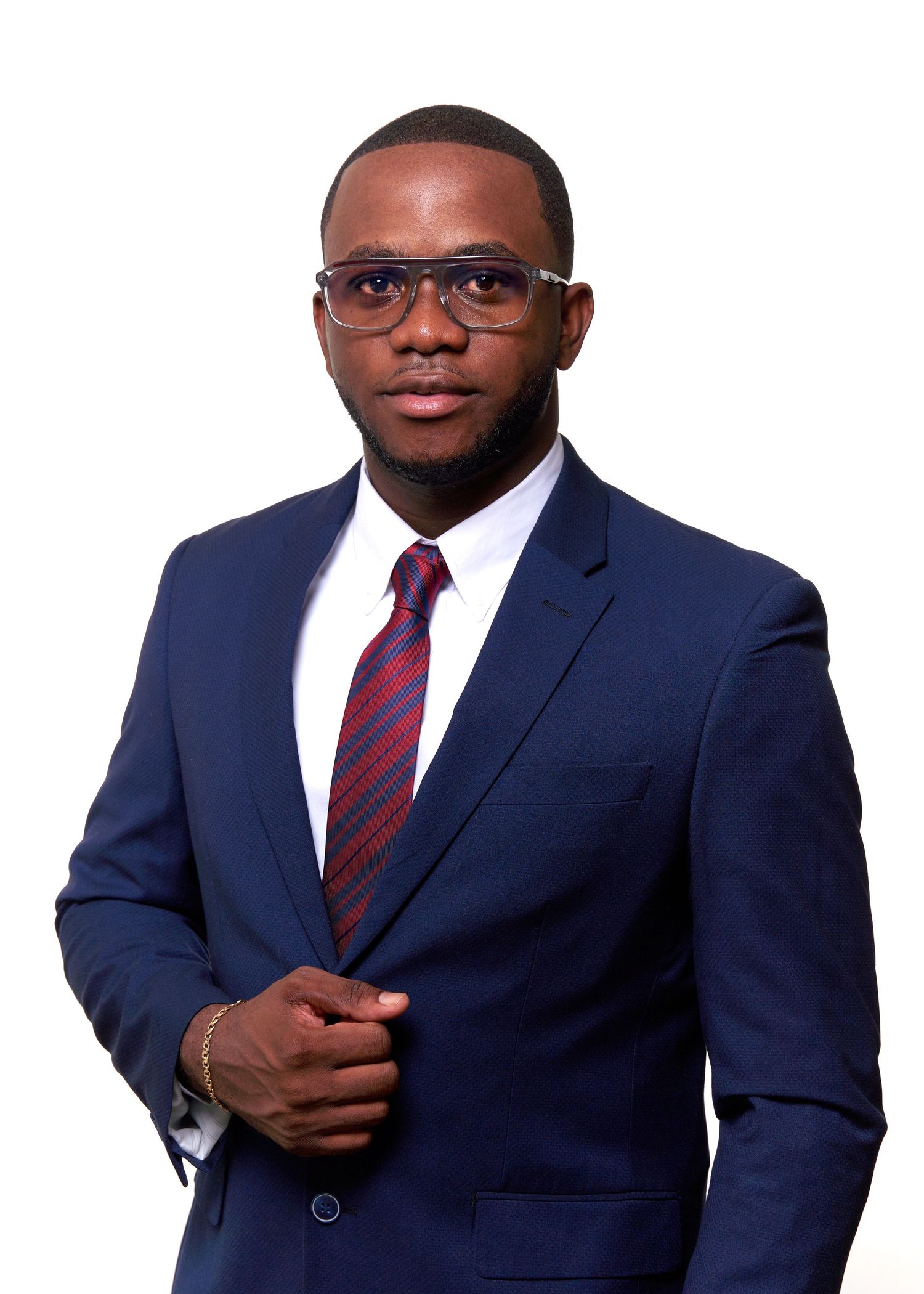Corporate headshots of someone in navy suit with striped tie against white background.