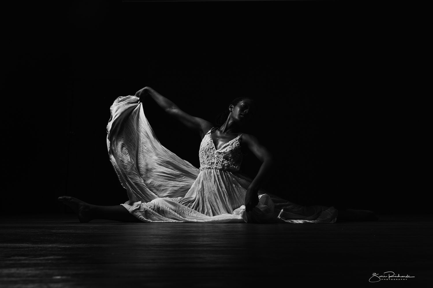 Minimalist dance photography series with dramatic movement in dark setting.