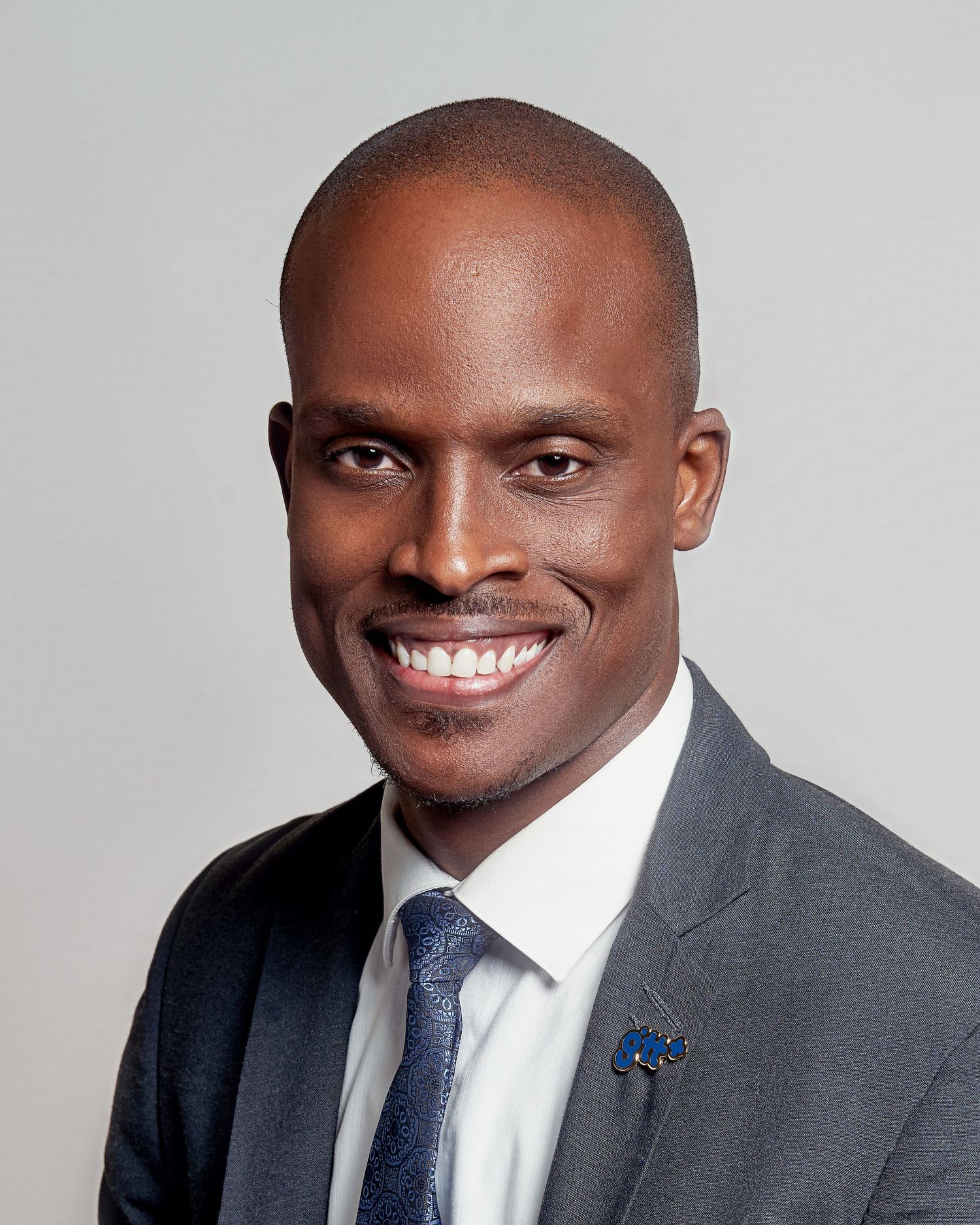 Professional headshot sequence showing different expressions against a light background.
