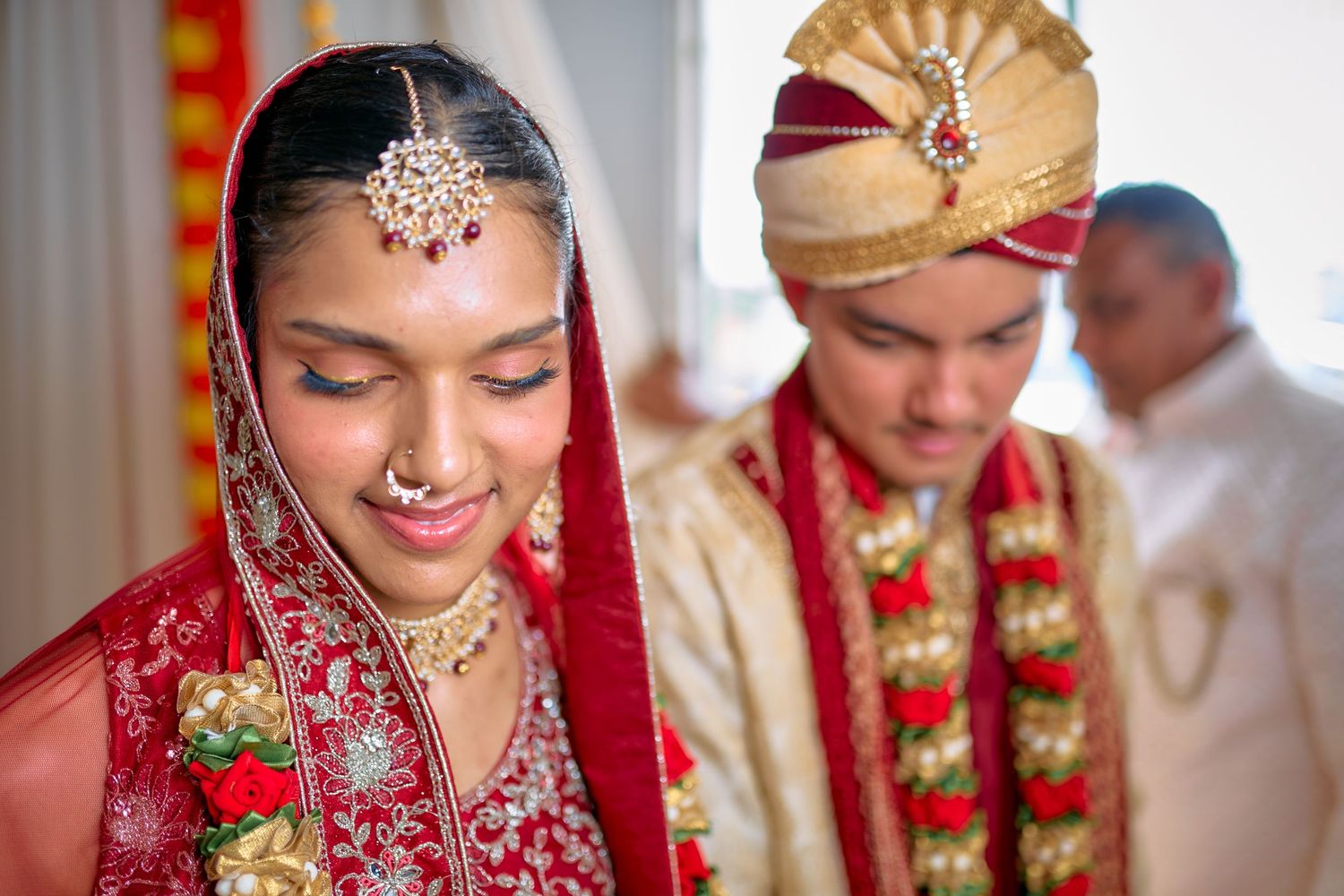Close-up shots of a traditional Hindu wedding ceremony with detailed bridal jewelry and decorations.