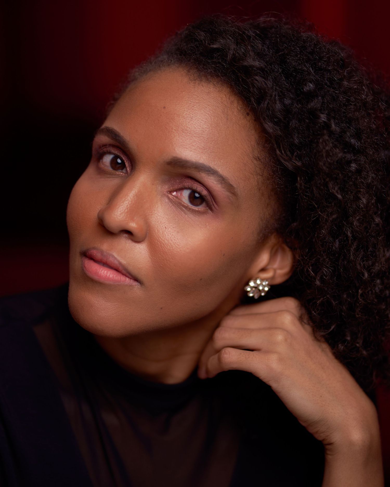 Close-up beauty portraits with soft lighting showing different elegant poses against dark background.