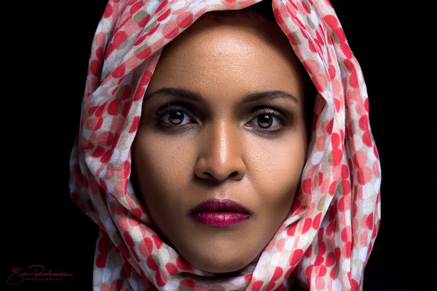 Dramatic portrait series featuring red and white patterned headscarf against black background.