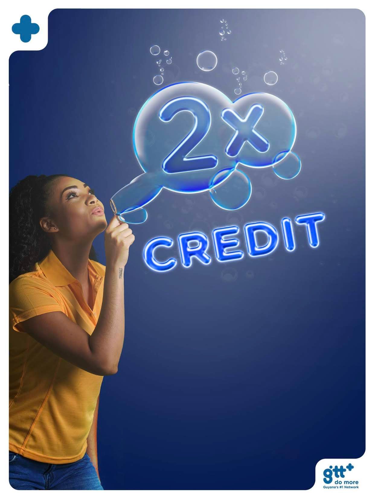 A person in a yellow top blows bubbles creating a glowing 2x credit effect against a dark blue background.