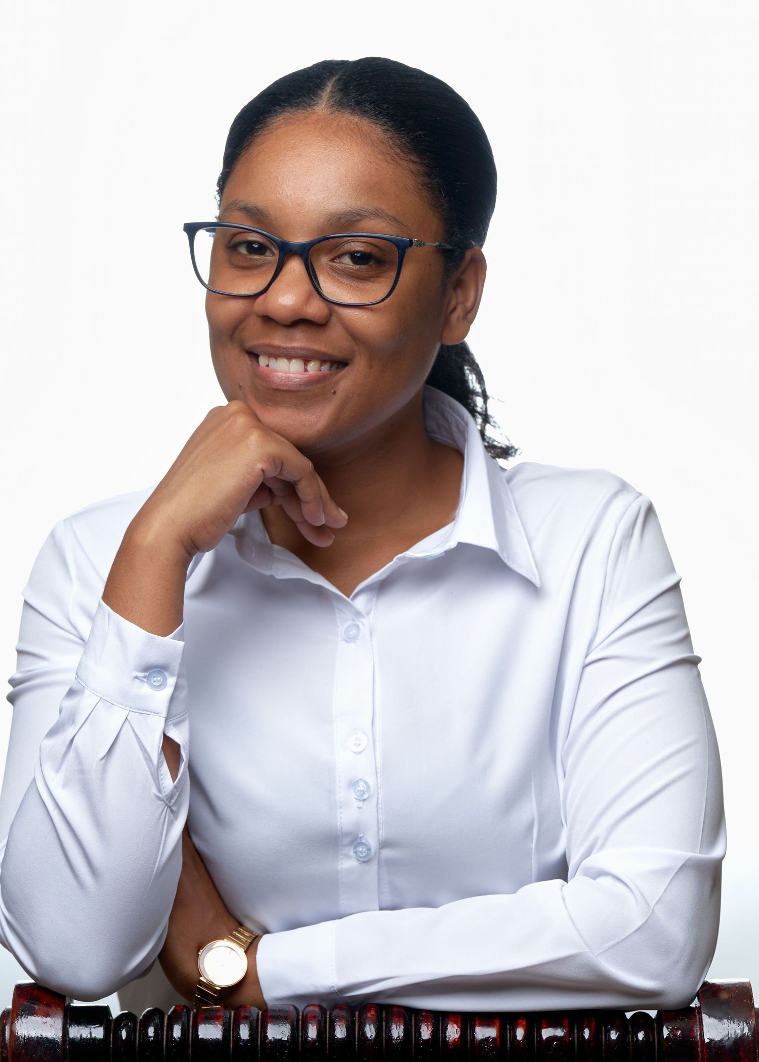 Professional portraits of someone in white button-down shirt and glasses showing various poses.
