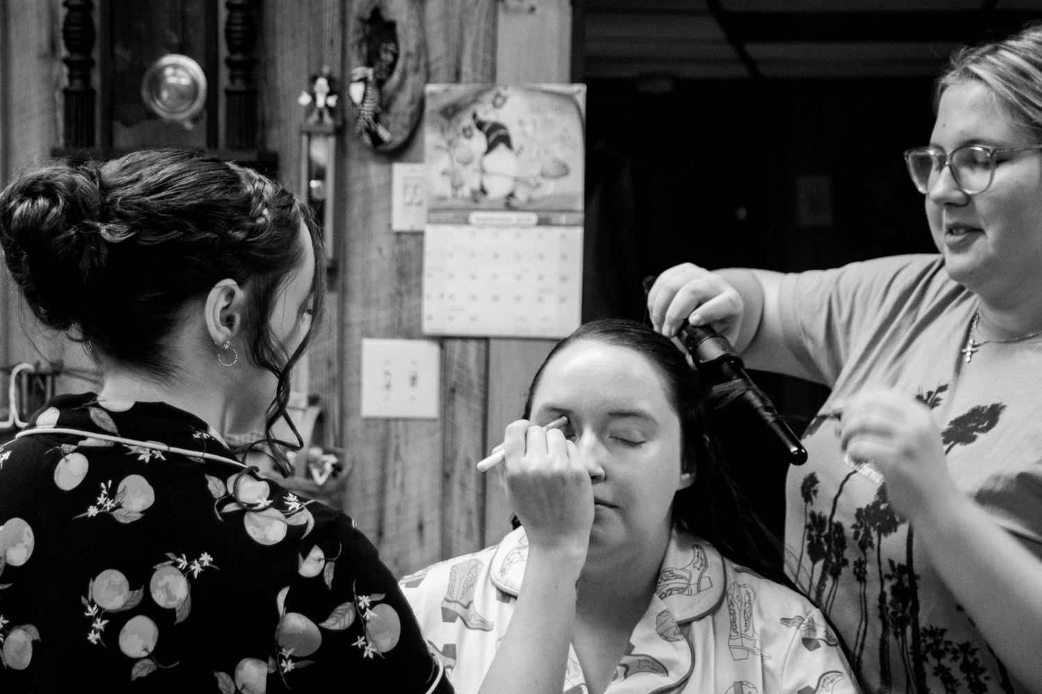 Candid black and white photos capturing genuine smiles and laughter at a wedding.