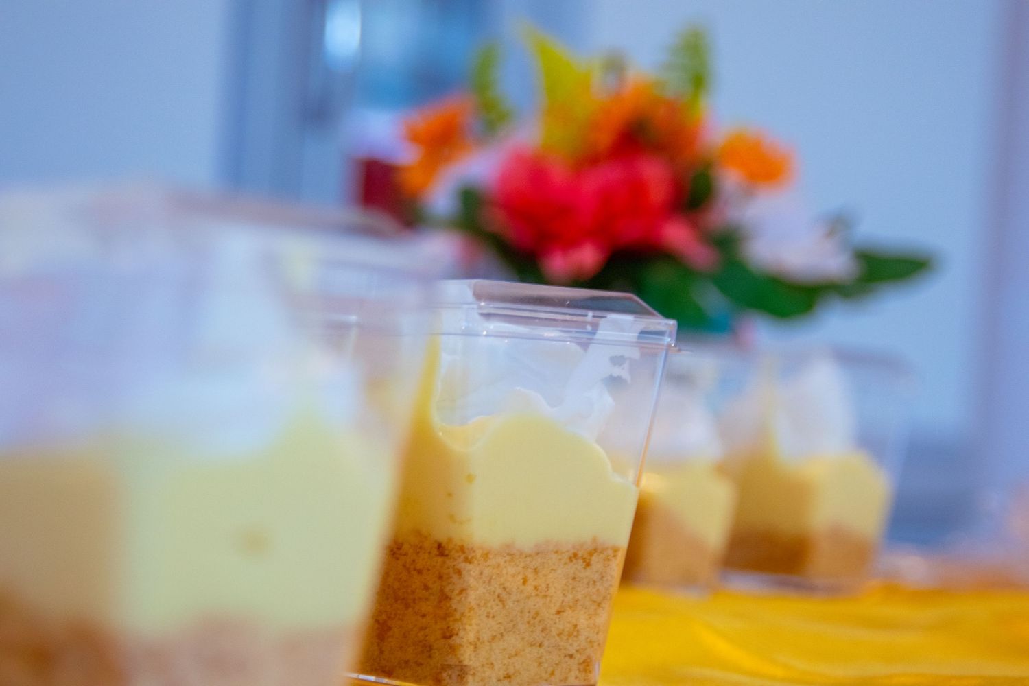 Dessert display featuring various sweet treats and beverages on a decorated table.