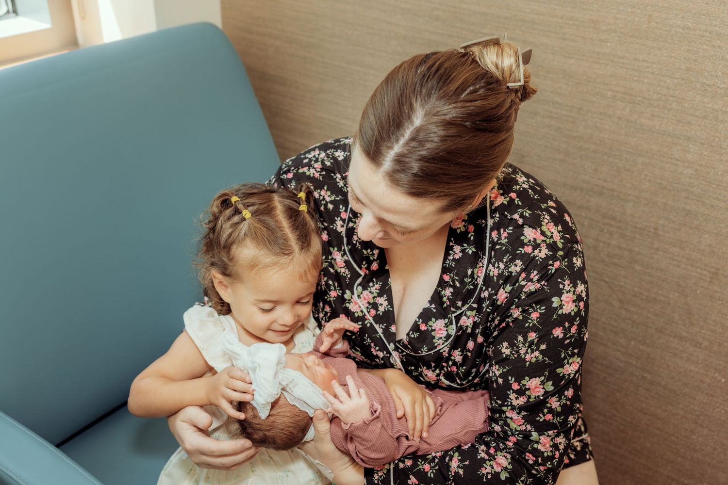 A series of photos showing a baby being fed from a bottle while being held in someone's arms.