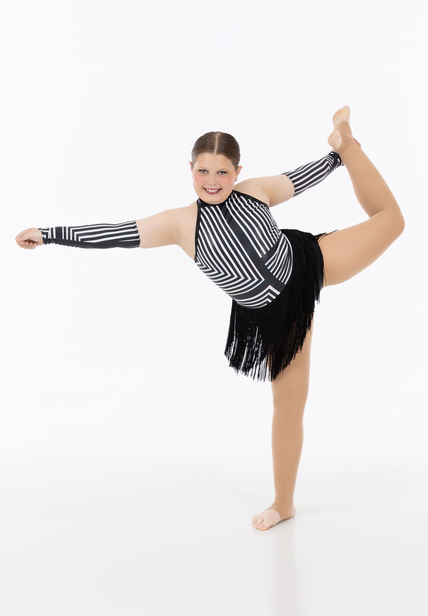 A dancer in a striped leotard performs a graceful high kick sequence against a white background.