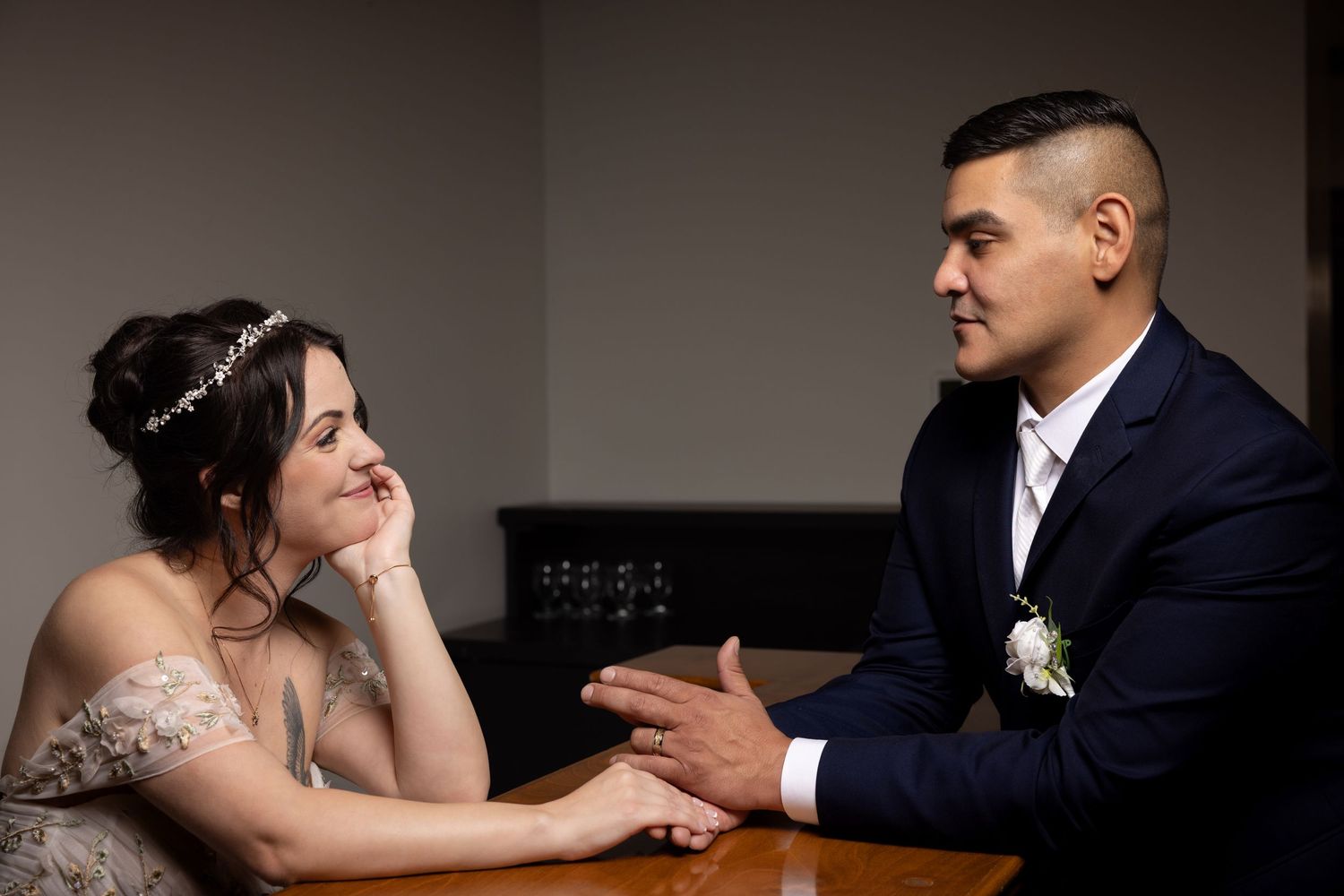 Romantic wedding couple sharing intimate moments together in a series of candid black and white photographs.