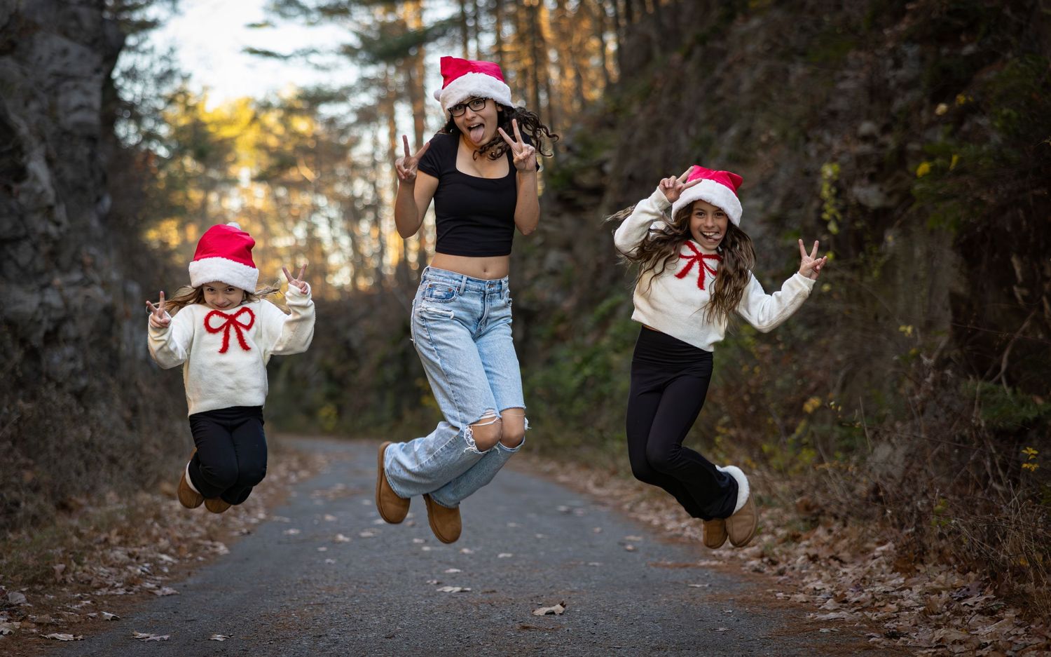 A series of cropped photos showing legs and feet jumping in a wooded path during autumn.
