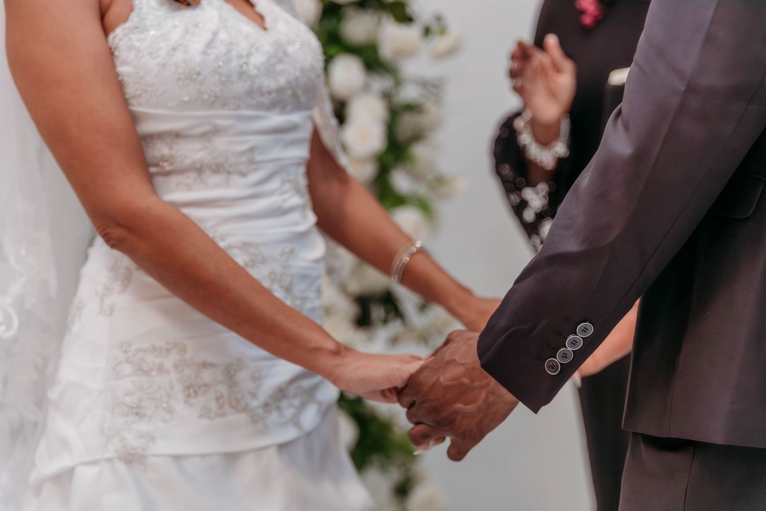 Couple exchanging vows during wedding ceremony in The Woodlands TX