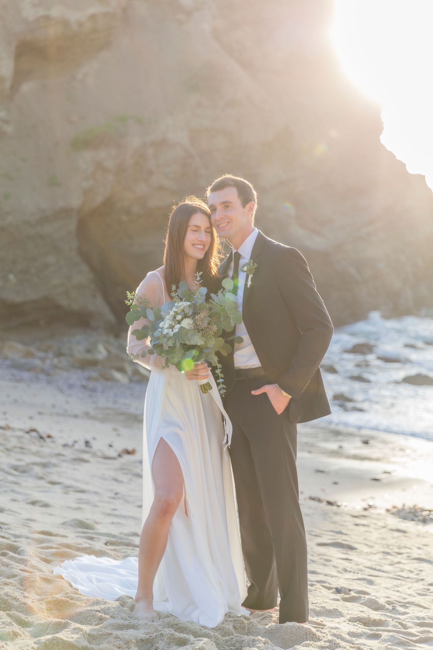 Beach wedding portrait of bride and groom photographed by Magnolia TX wedding photographer