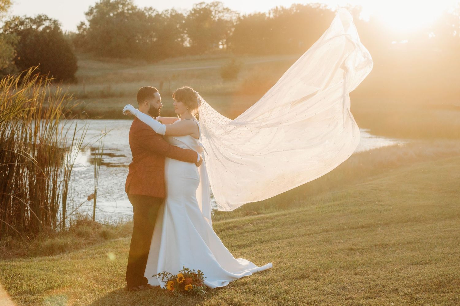 Bride and groom embracing during golden hour photographed by Magnolia TX wedding photographer