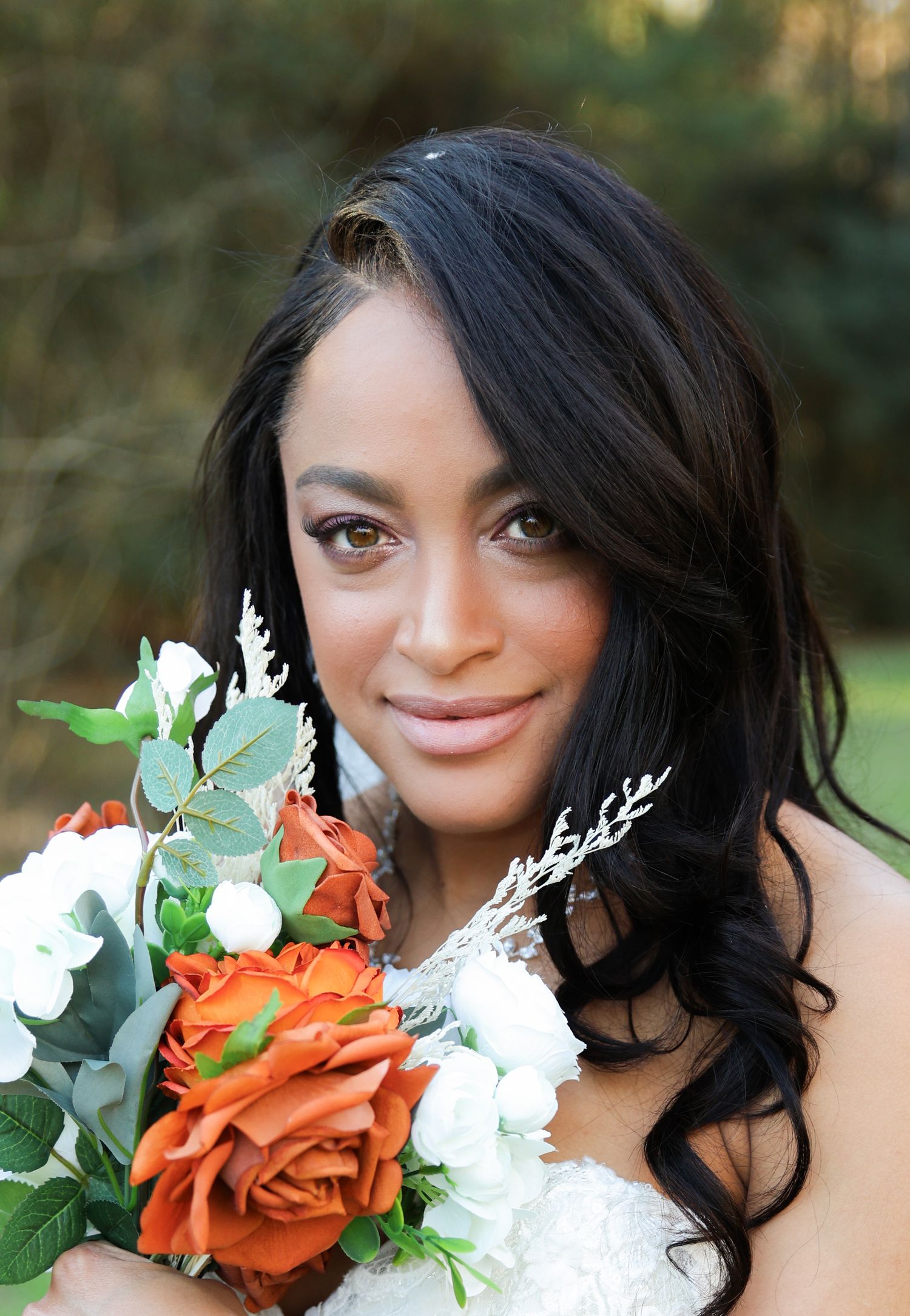 Bride smiling during wedding portrait session photographed in Magnolia TX
