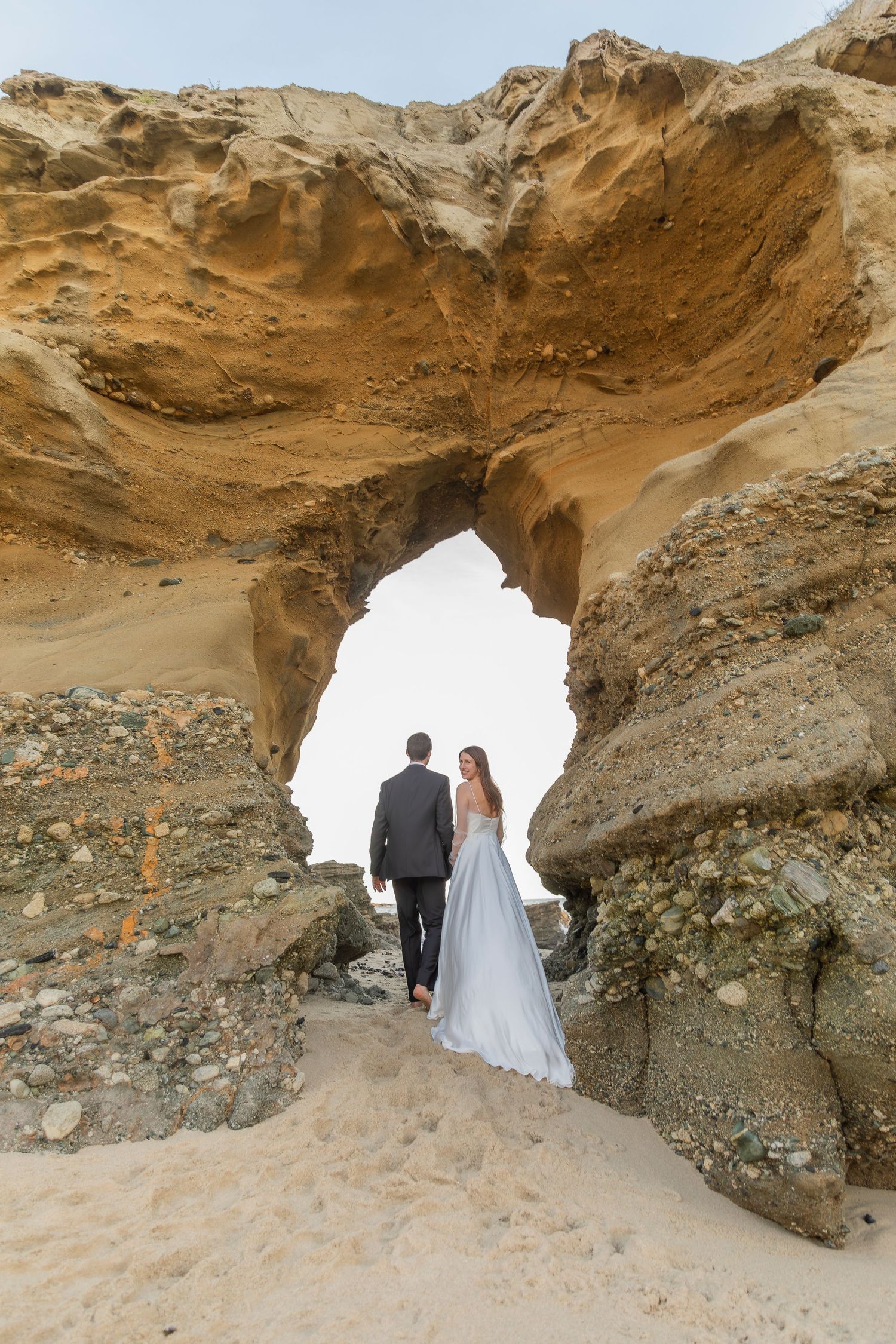Oceanfront wedding portrait of bride and groom photographed in California