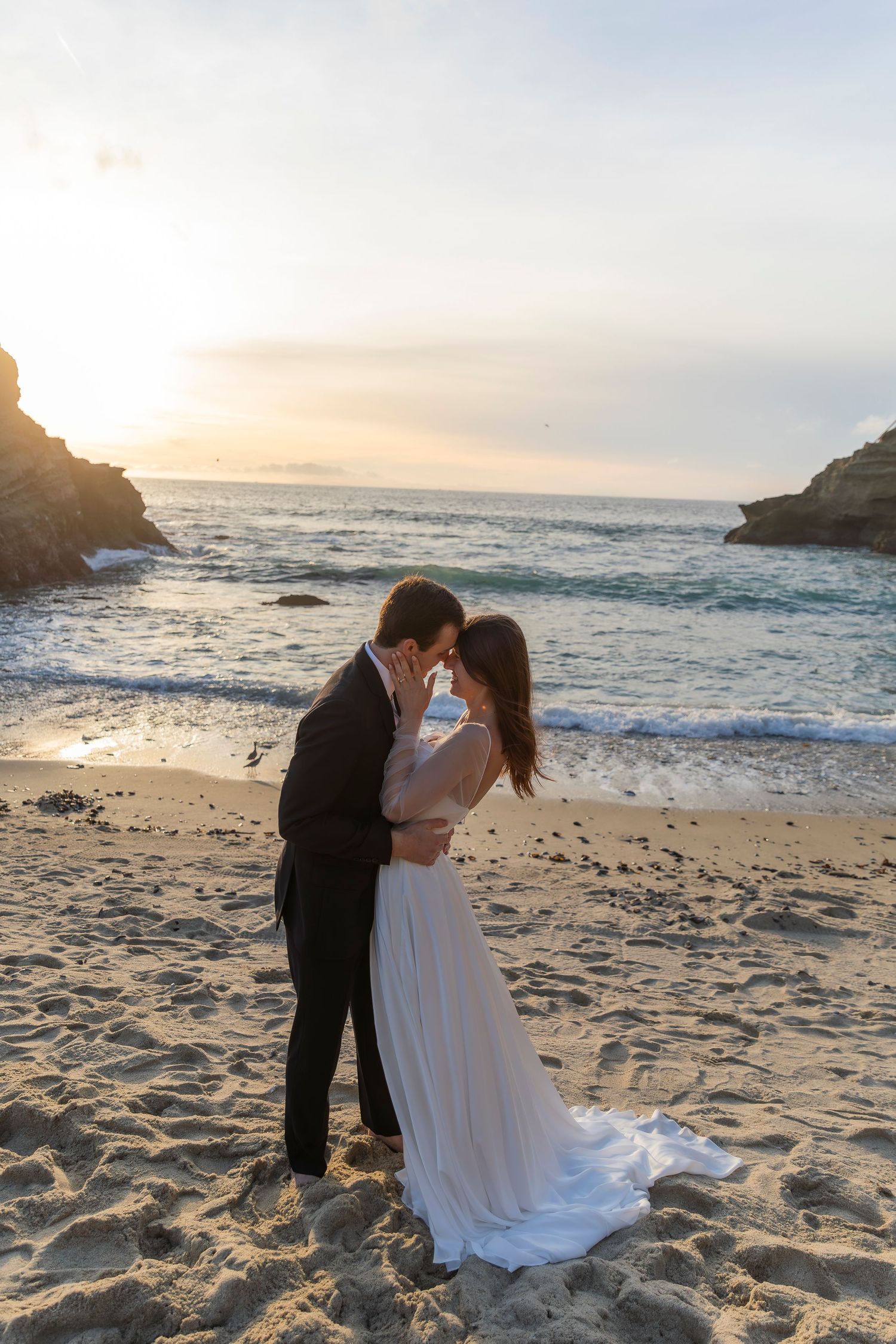 Romantic beach bridal portrait in warm golden light
