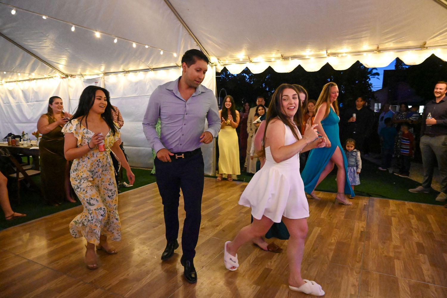 Wedding reception dance floor with guests enjoying the evening celebration.
