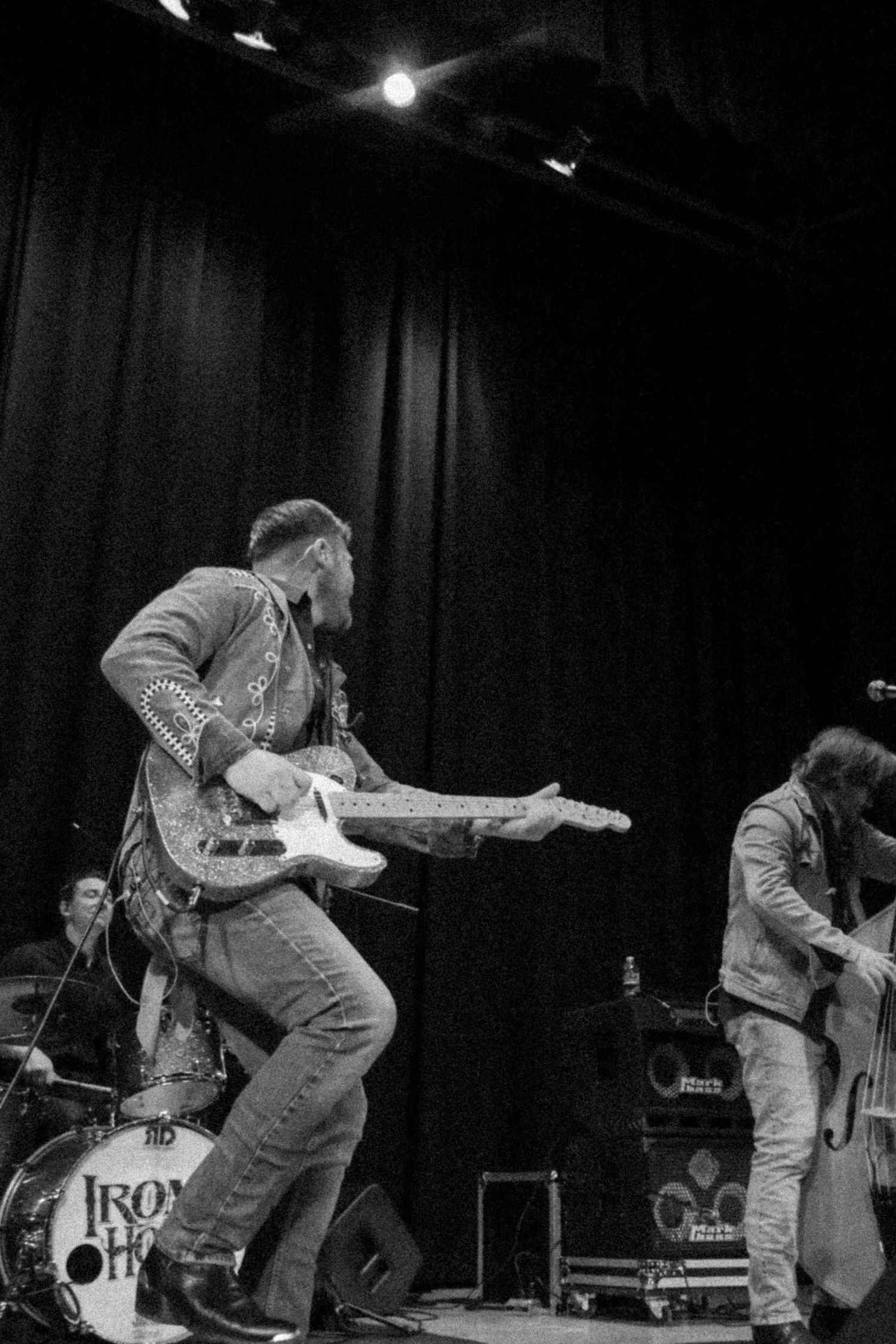 The band Iron Horse plays while all three have a lot of energy. Photo in black and white