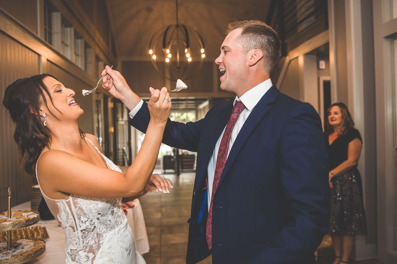 Couple performs playful dance moves during their wedding reception celebration.