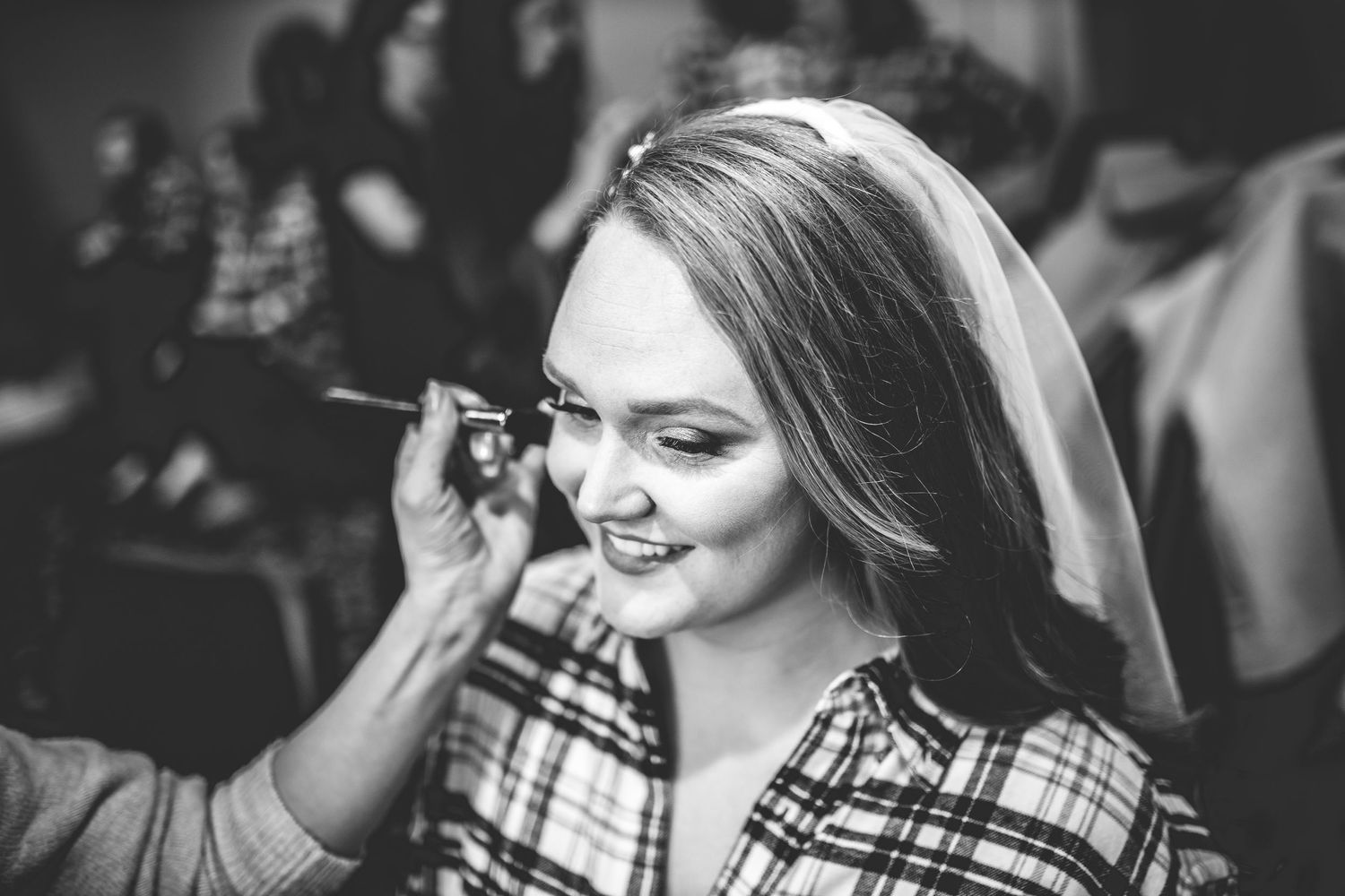 Black and white candid shots of wedding preparation moments.