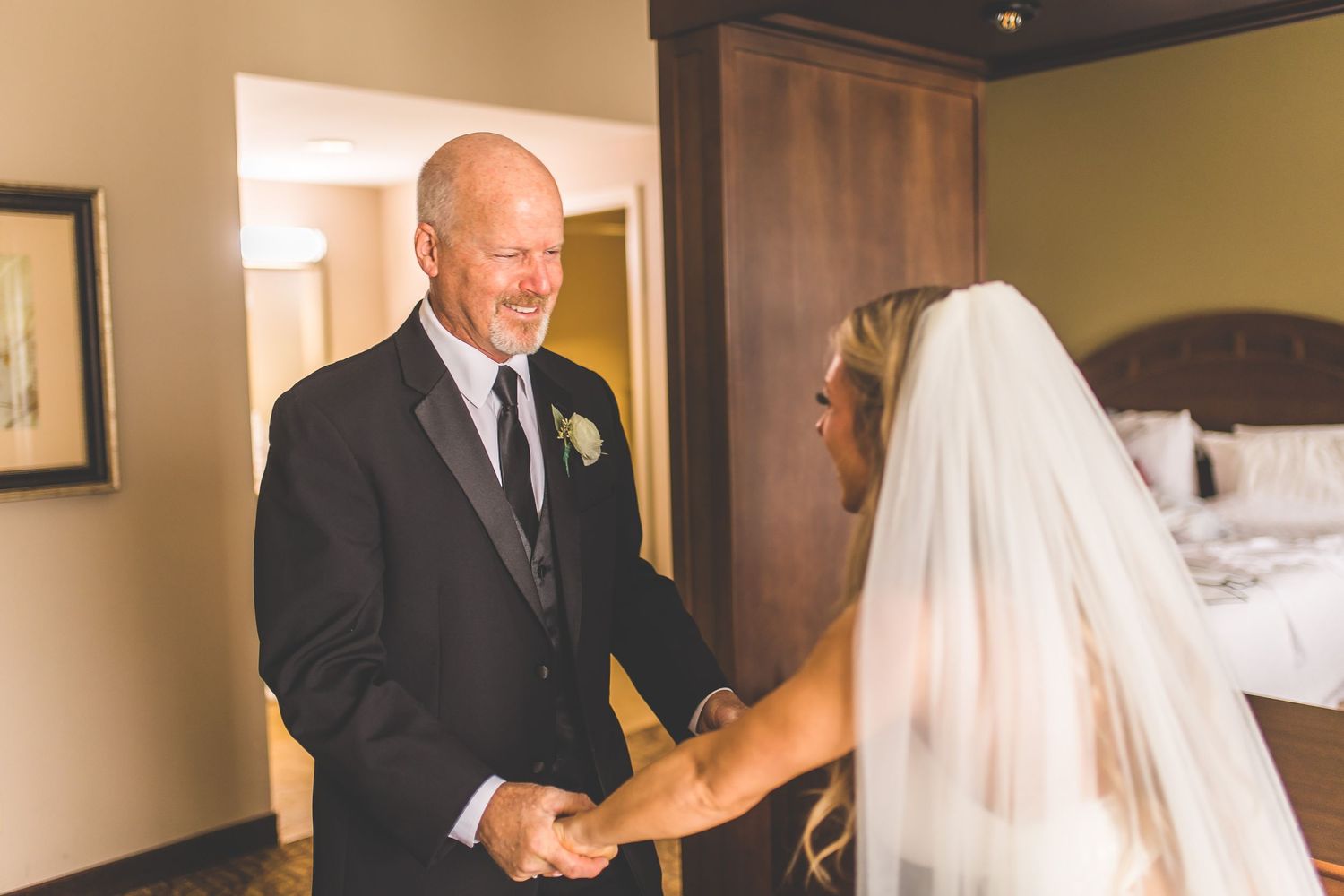 Emotional moments captured during wedding day preparations.