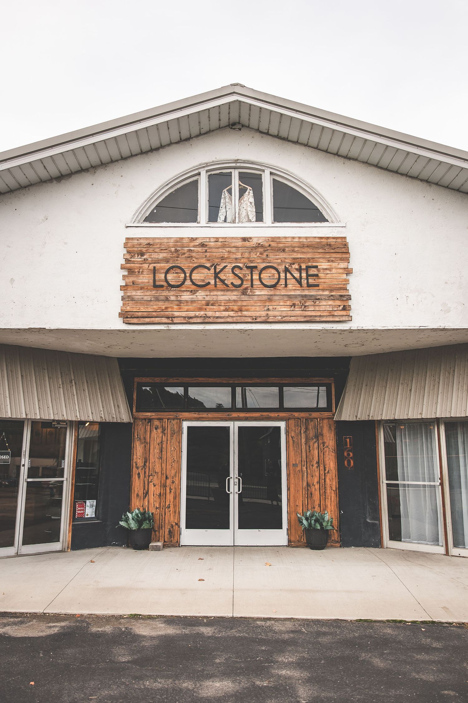 Exterior view of Lockstone venue building with wooden accents and modern design.