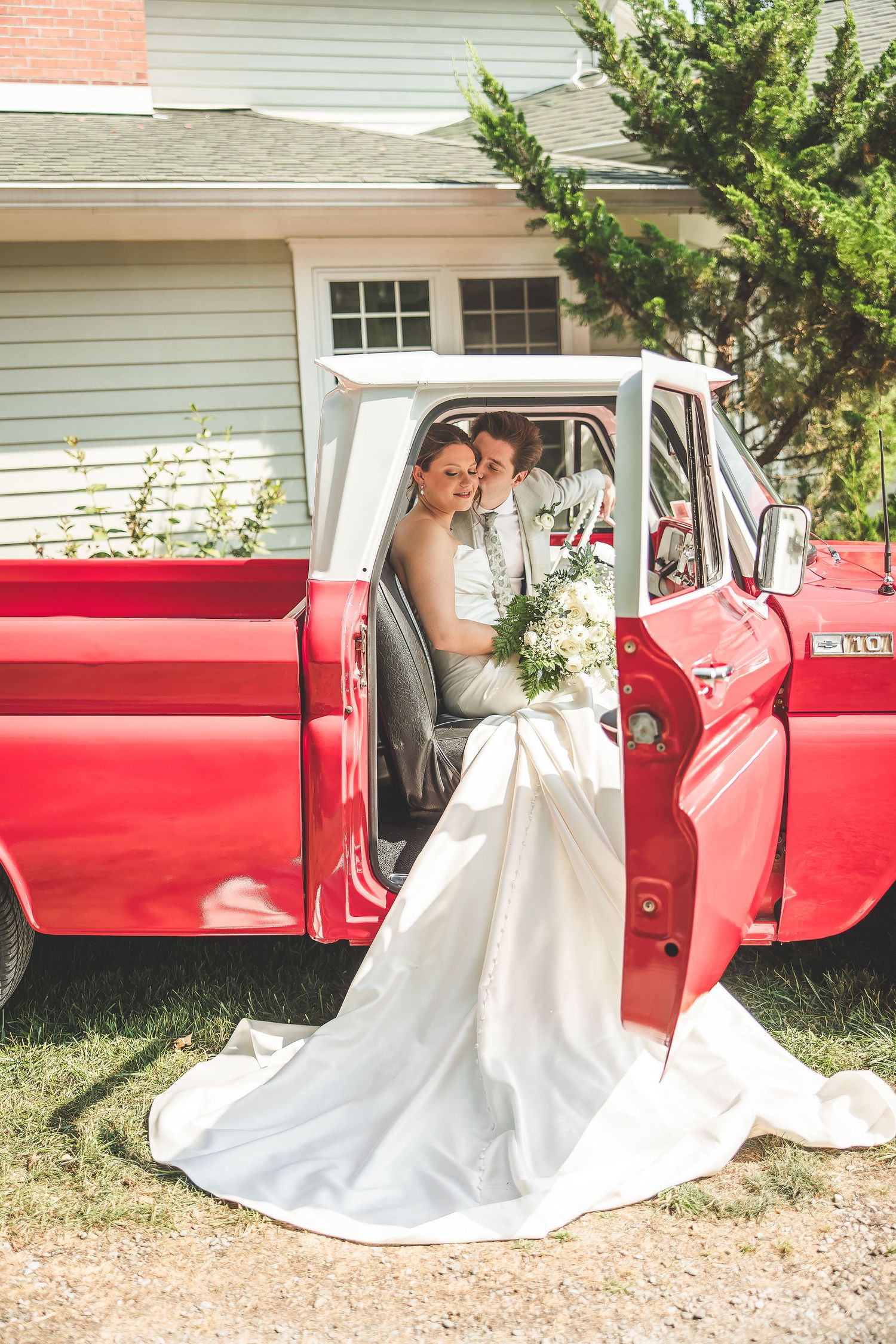 Wedding photography sequence with vintage red Chevrolet truck against white house backdrop.