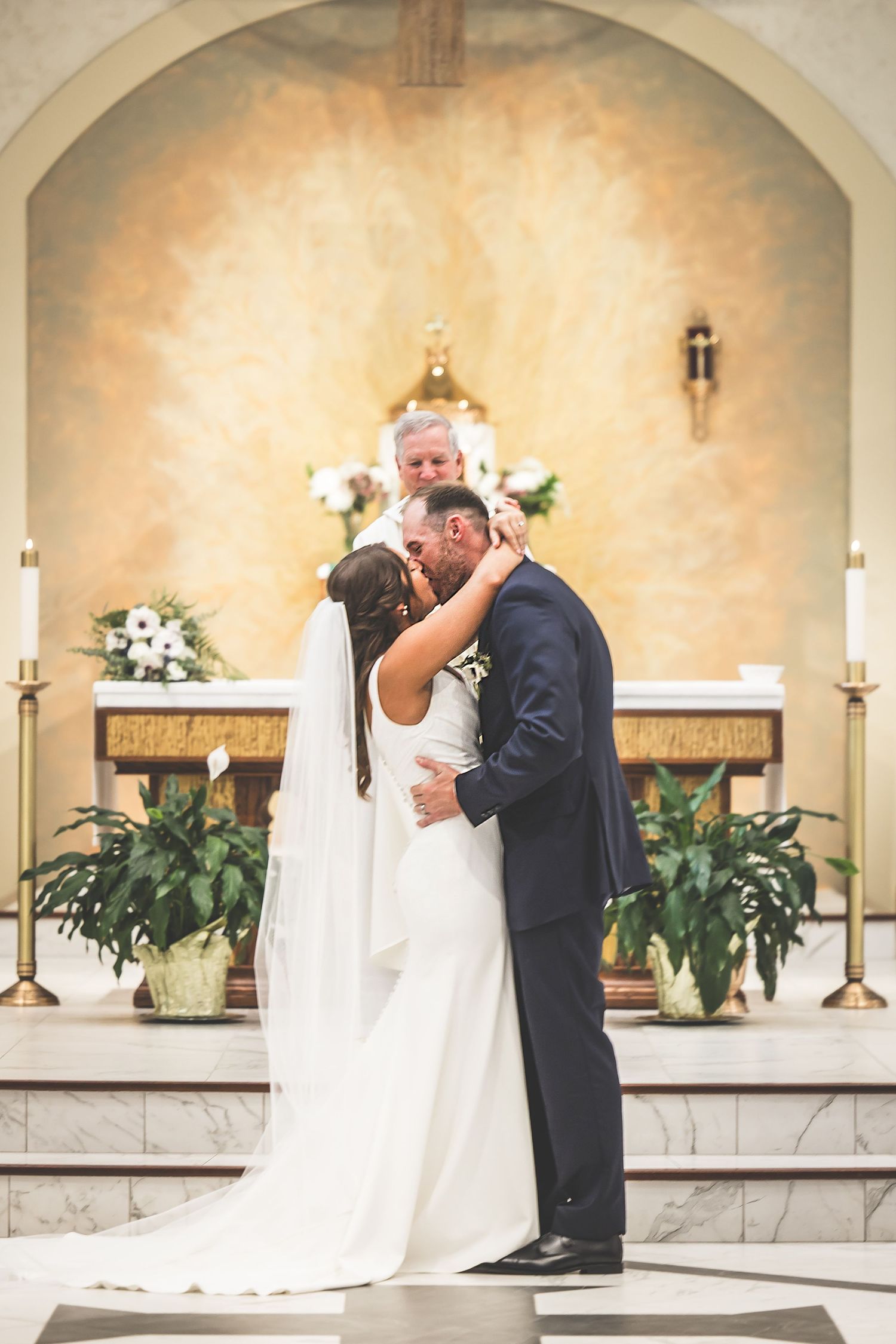 A sequence of wedding ceremony moments captured under arched church architecture with floral decorations.