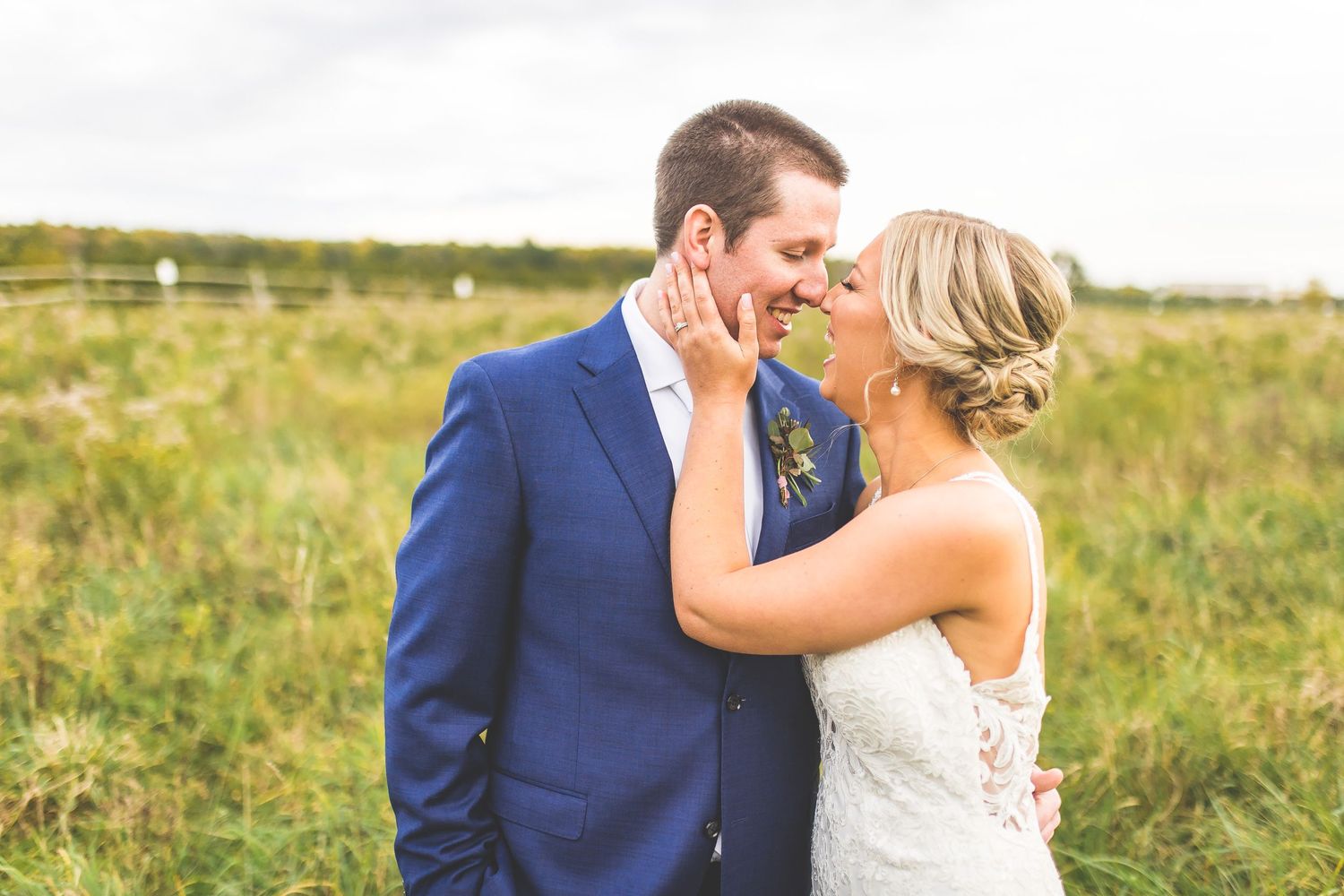 Romantic embrace captured between couple during outdoor wedding photography session.