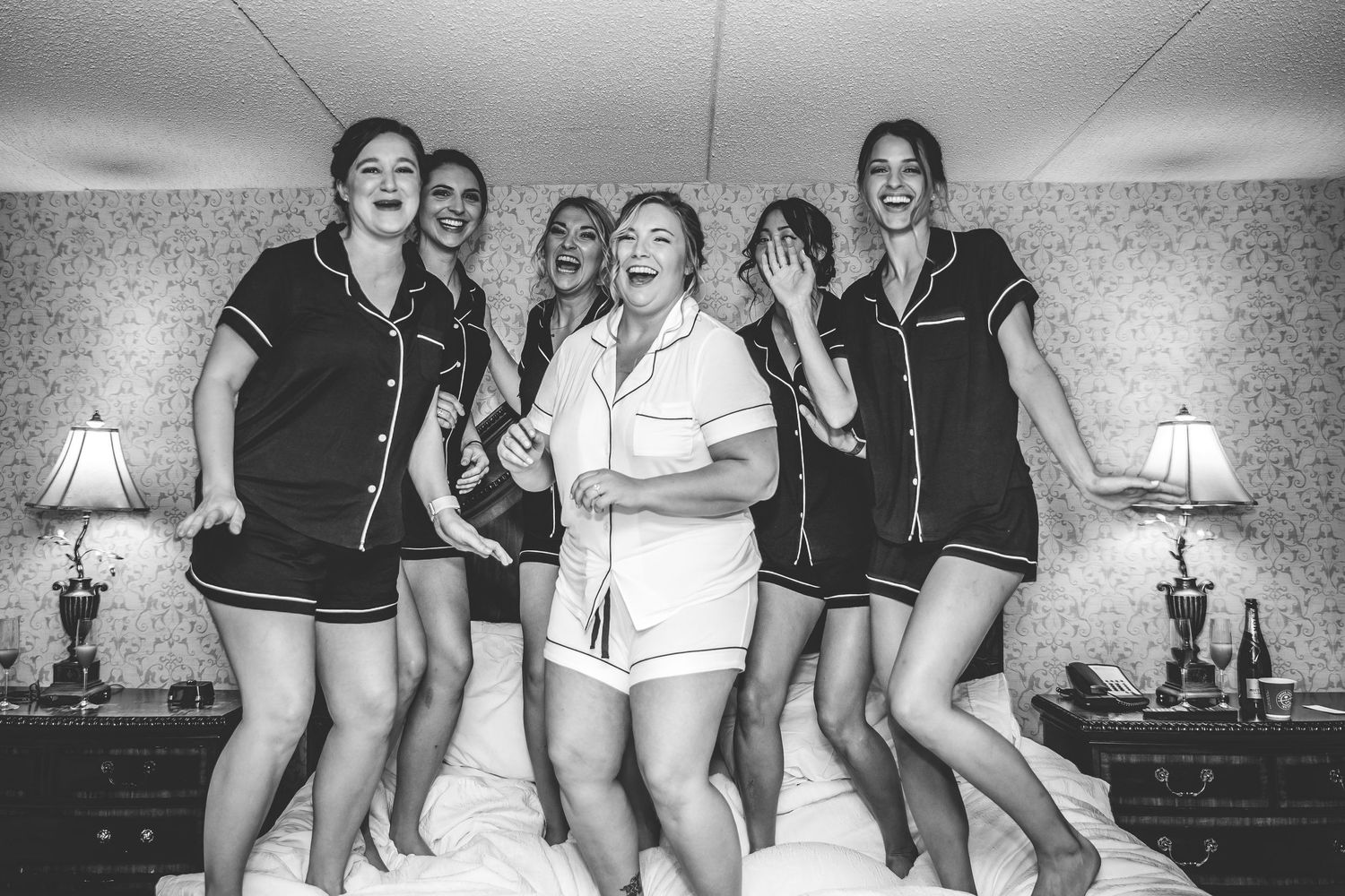 Candid moments of bridal party laughing together in matching outfits.