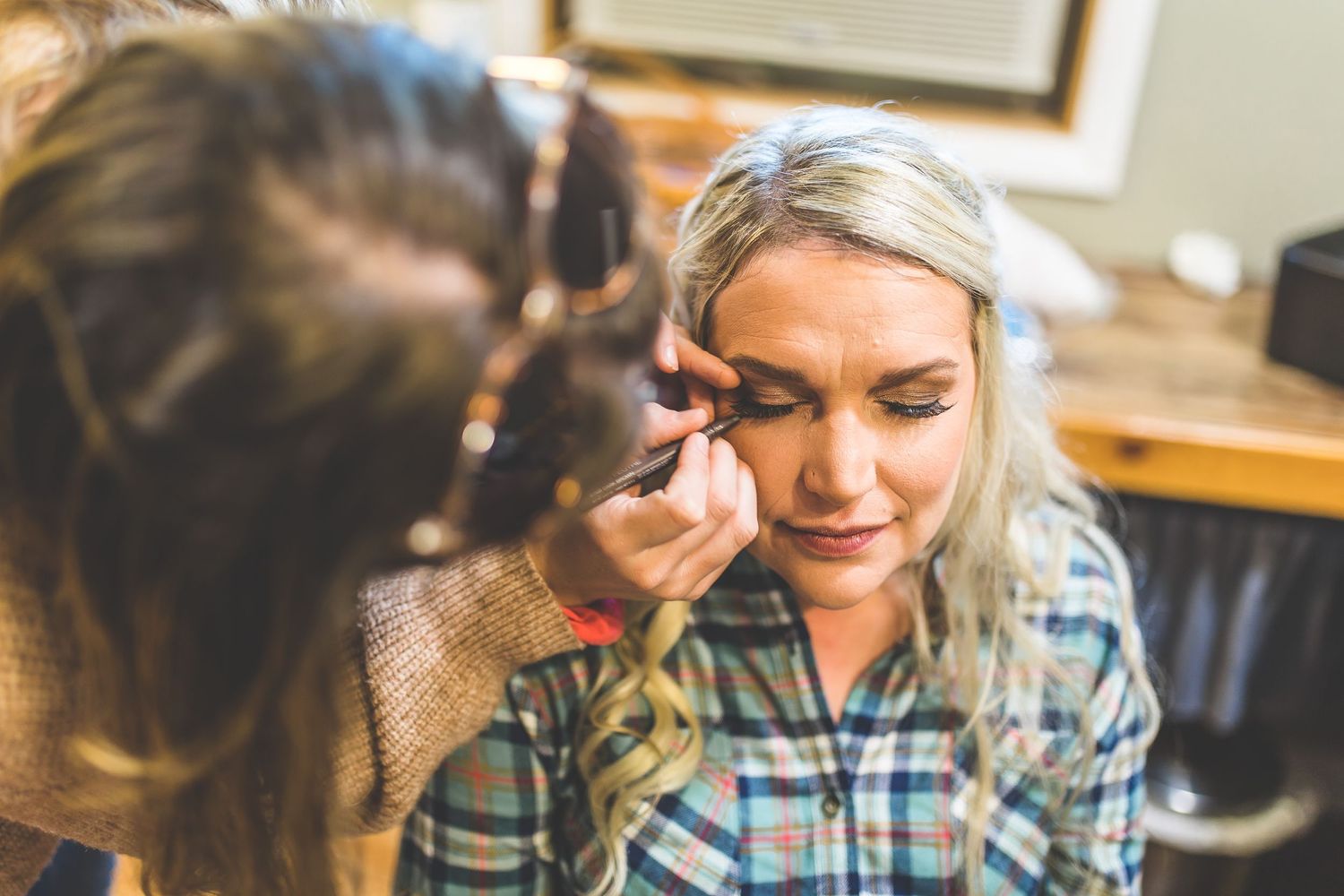 Candid moments captured during wedding day preparations.