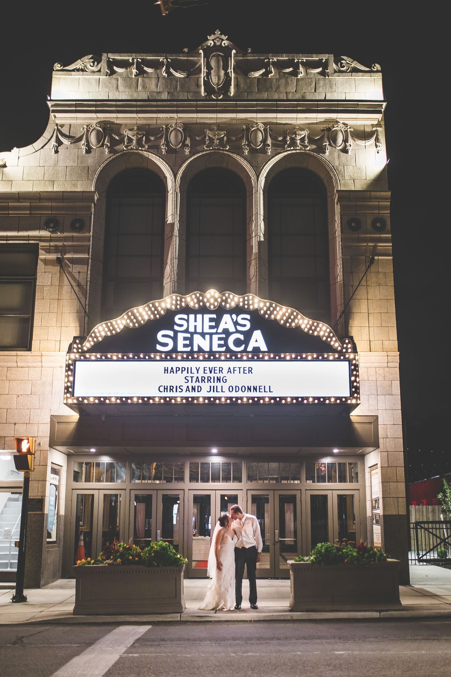 Historic Seneca Shea's theater marquee lit up at night with ornate architectural details.