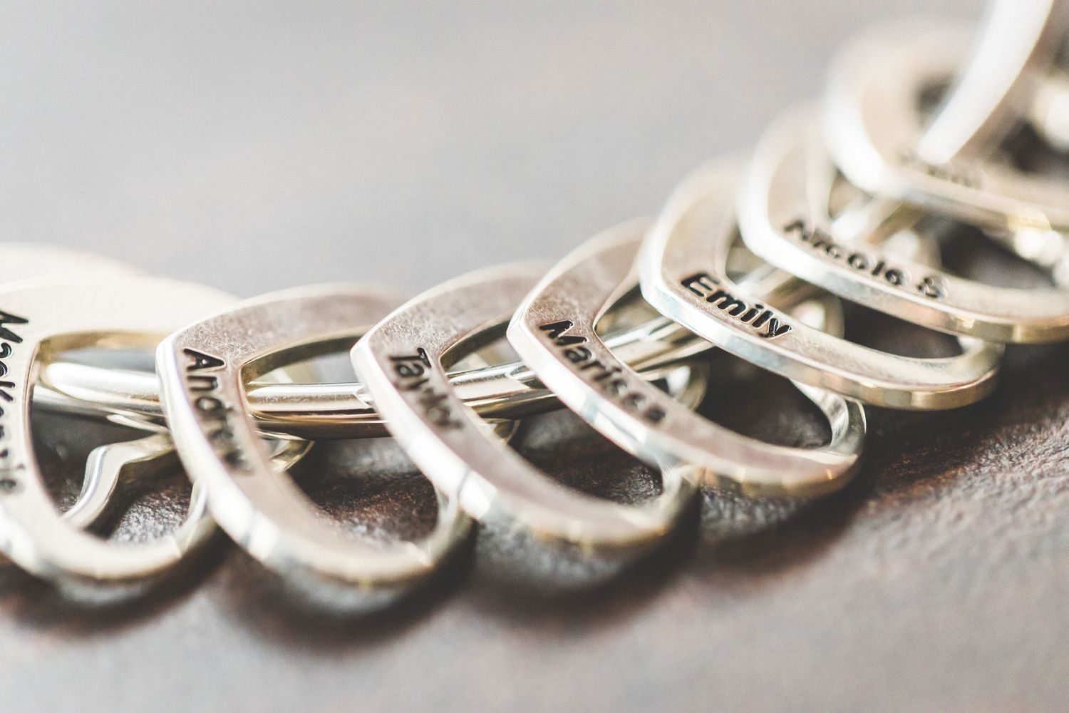 Macro close-up of a delicate silver chain bracelet or necklace with intricate links.