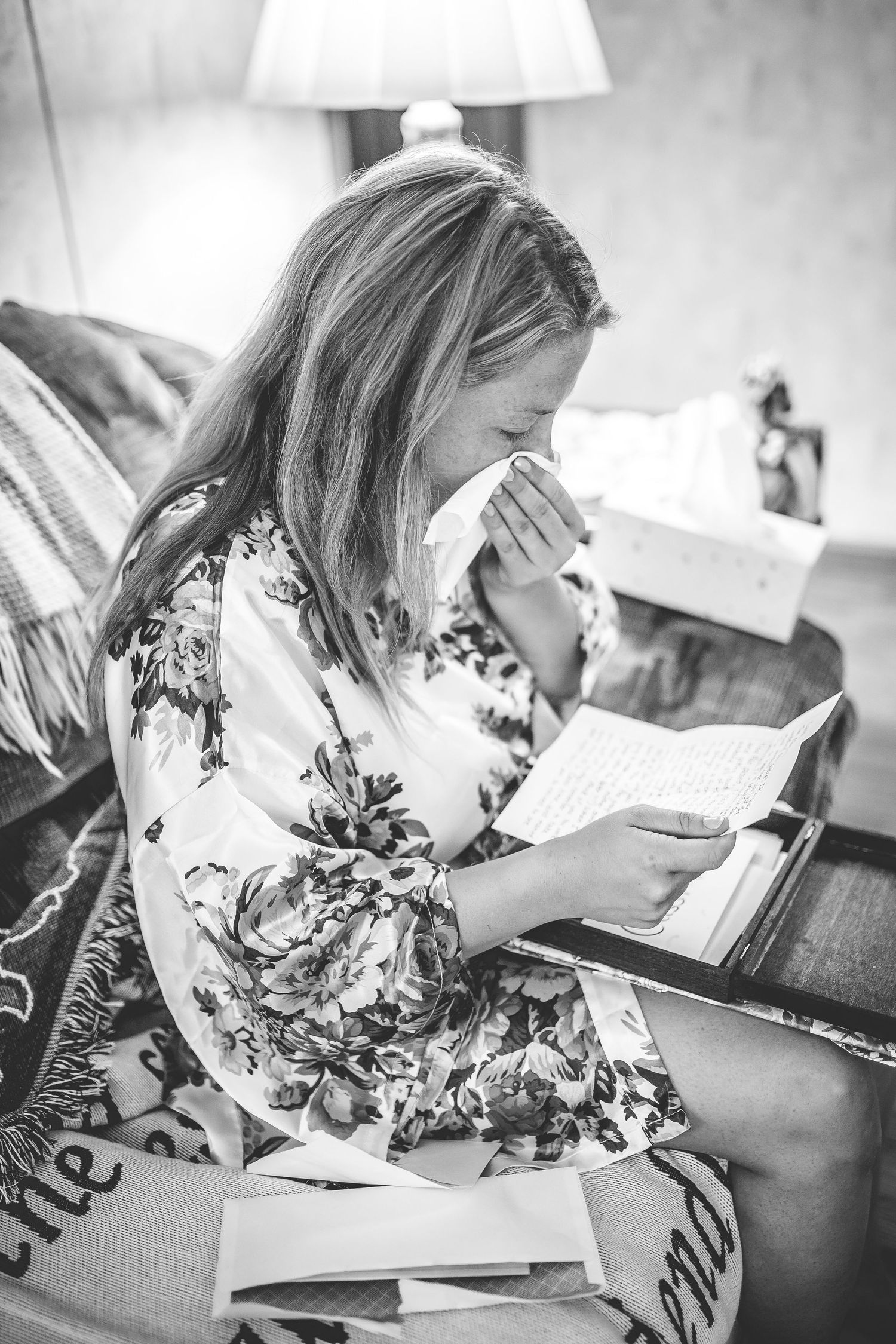 Black and white image of wedding preparation with handwritten notes and floral details.