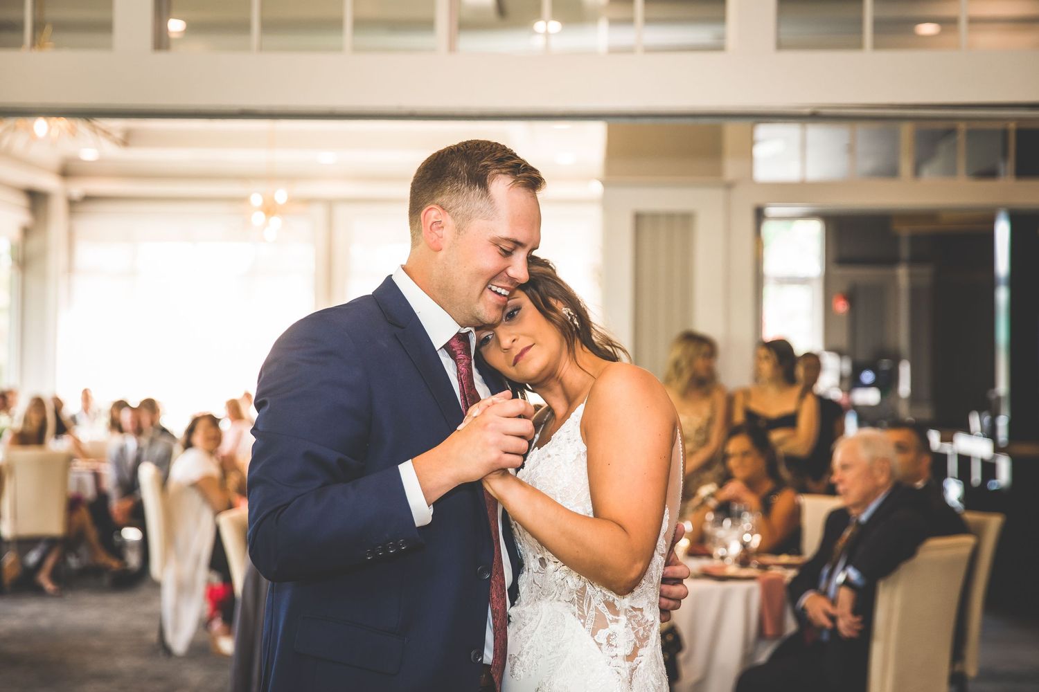 Couples dancing together during an elegant wedding reception.