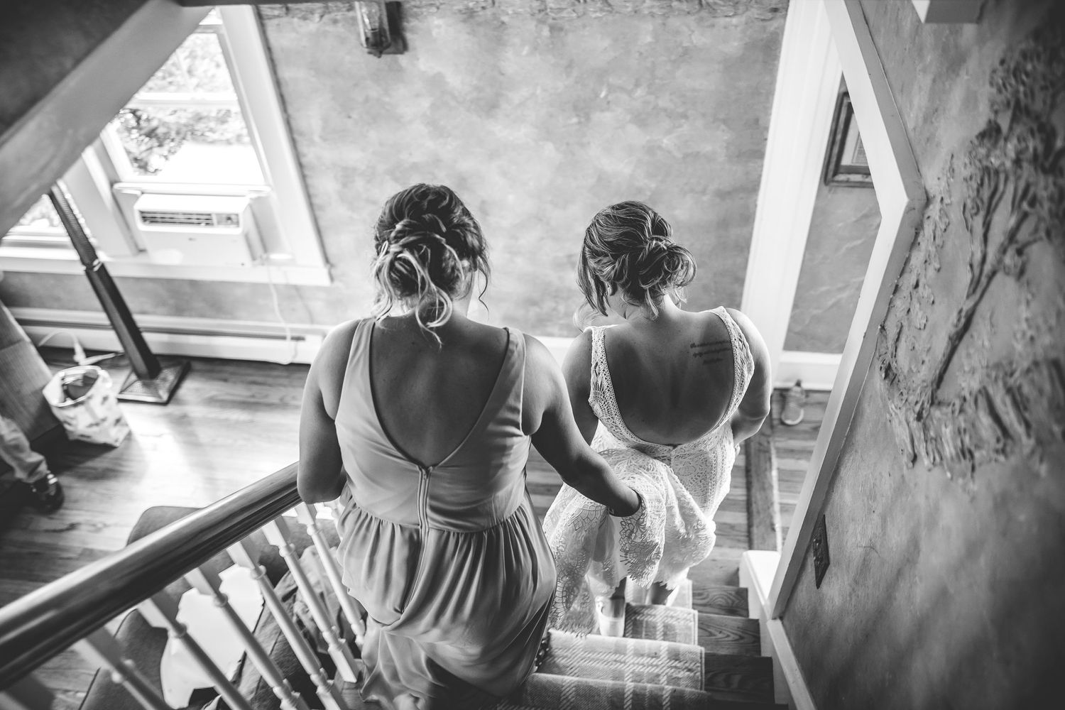 Black and white candid shots showing preparations in an indoor space.