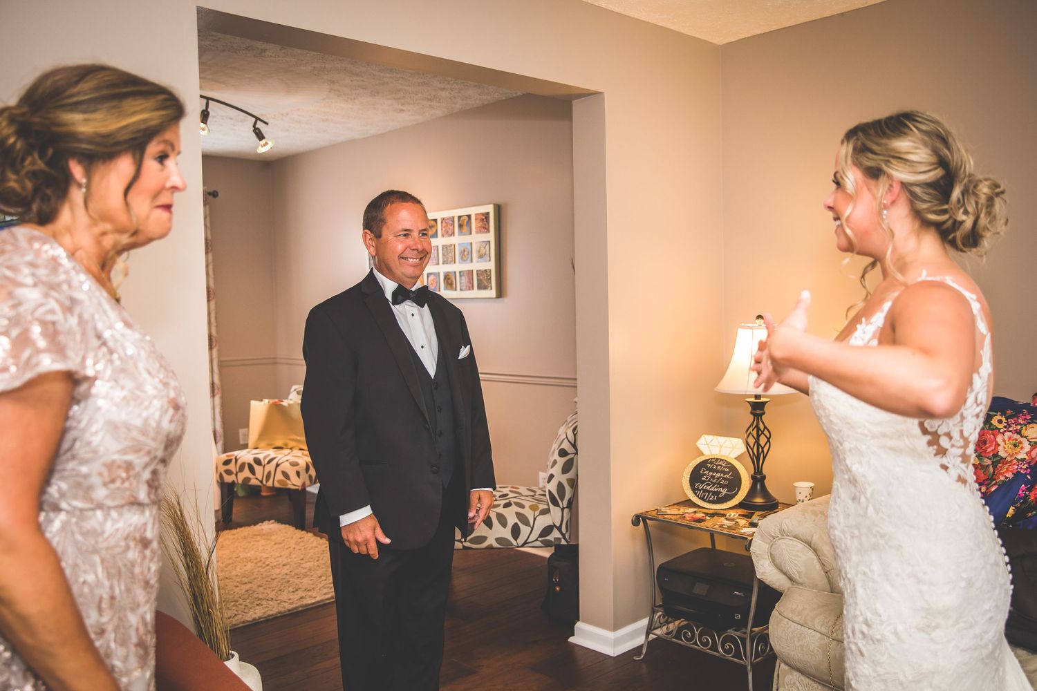 Wedding party members preparing for the ceremony in an indoor venue.