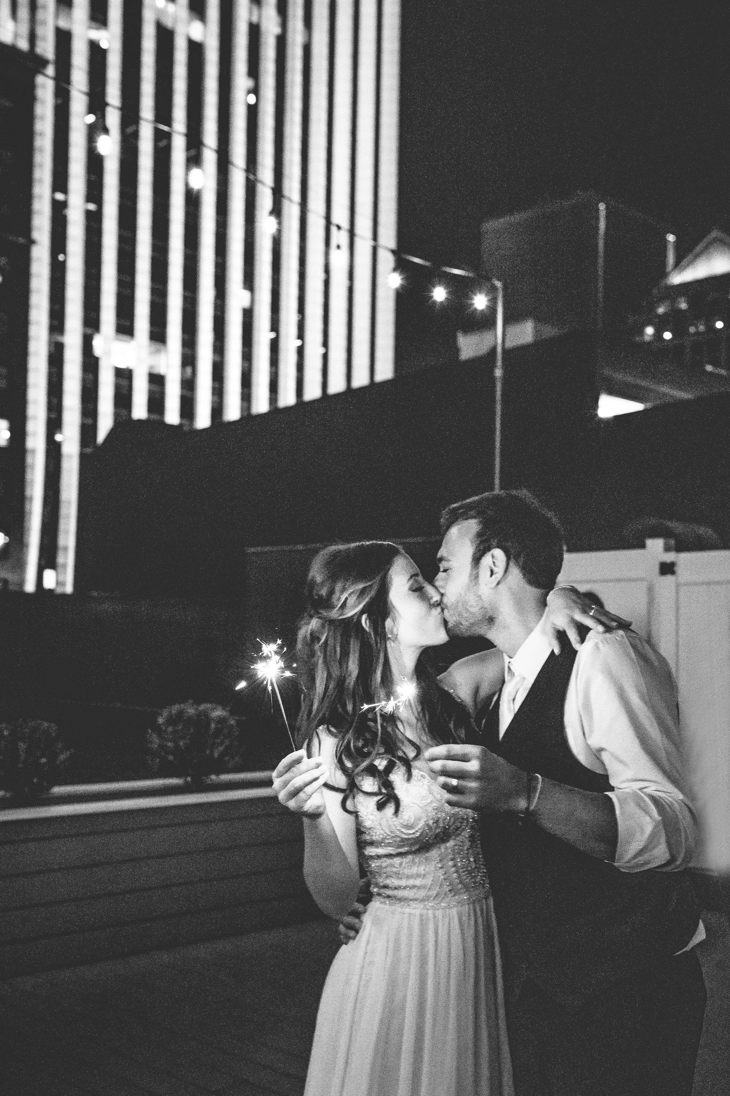 Black and white dance floor moments captured during an evening wedding reception.