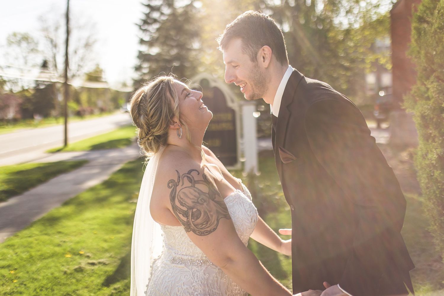 Sunlit wedding portraits captured in golden hour light.