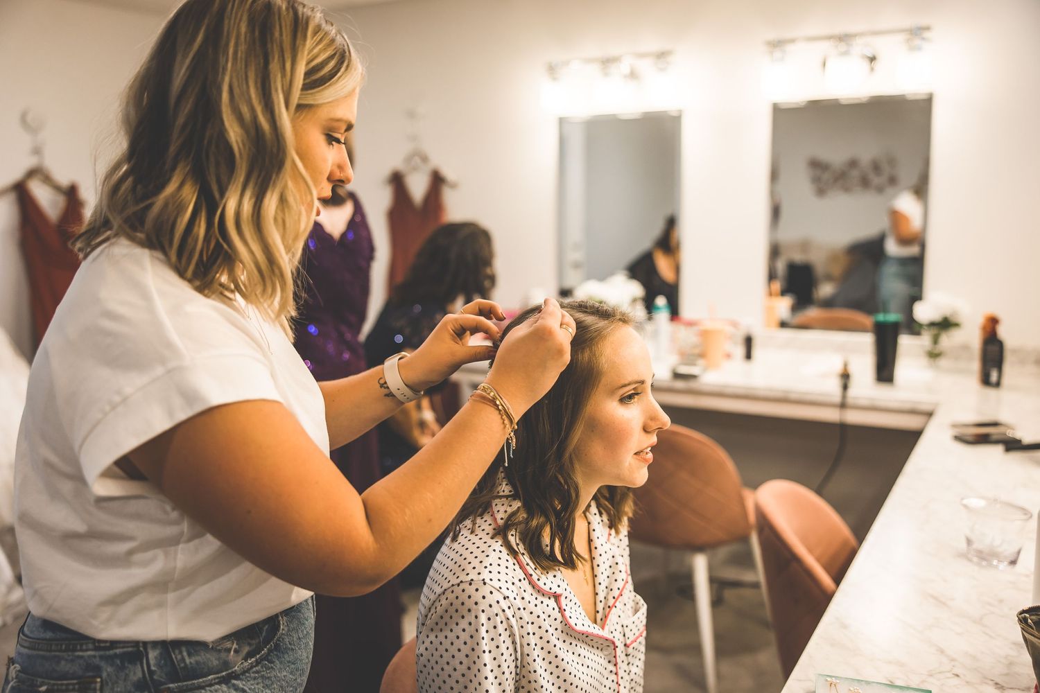 Group getting ready in matching outfits in bright indoor space.