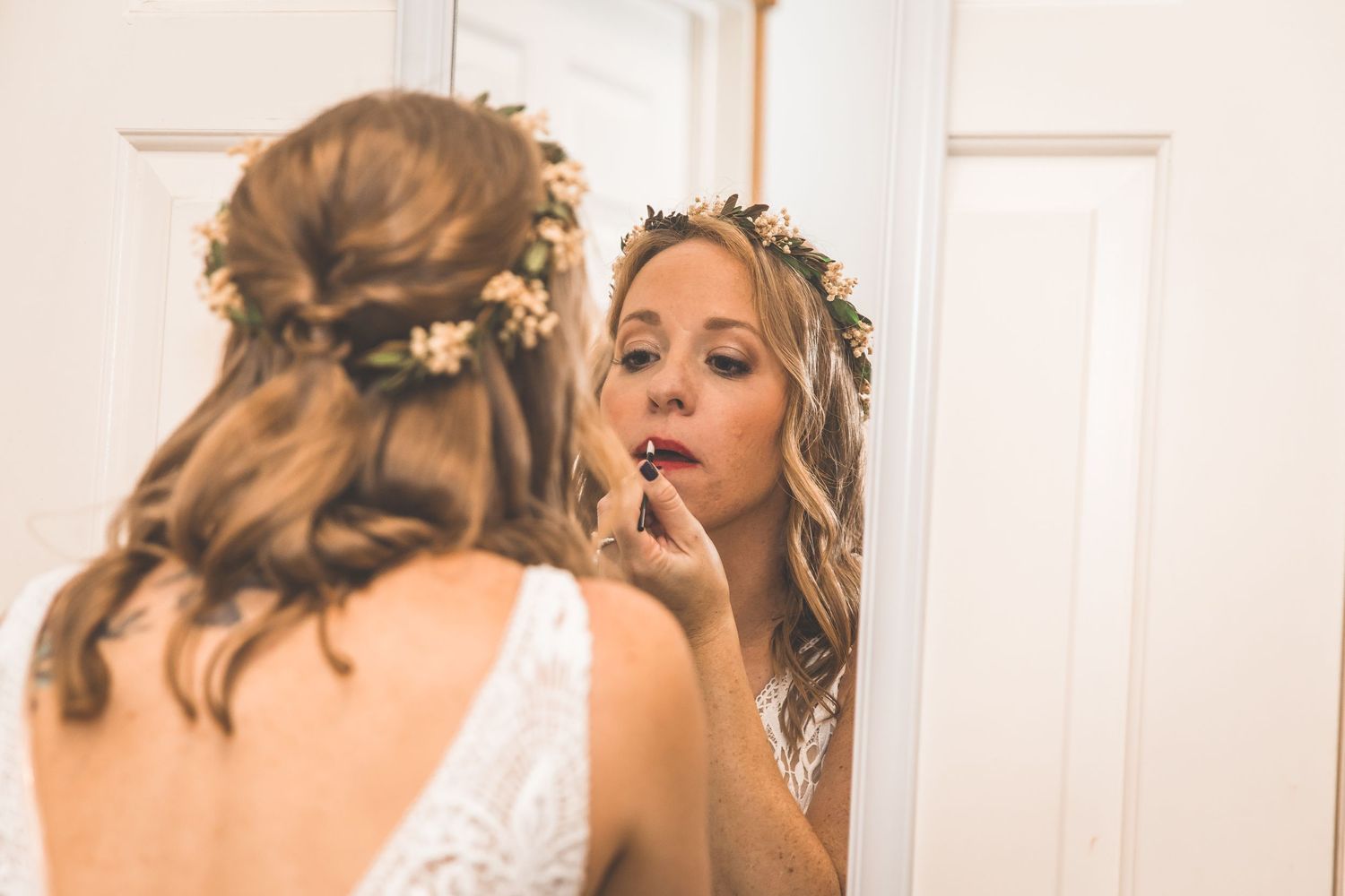 Wedding preparation scene with bridal accessories and floral details.